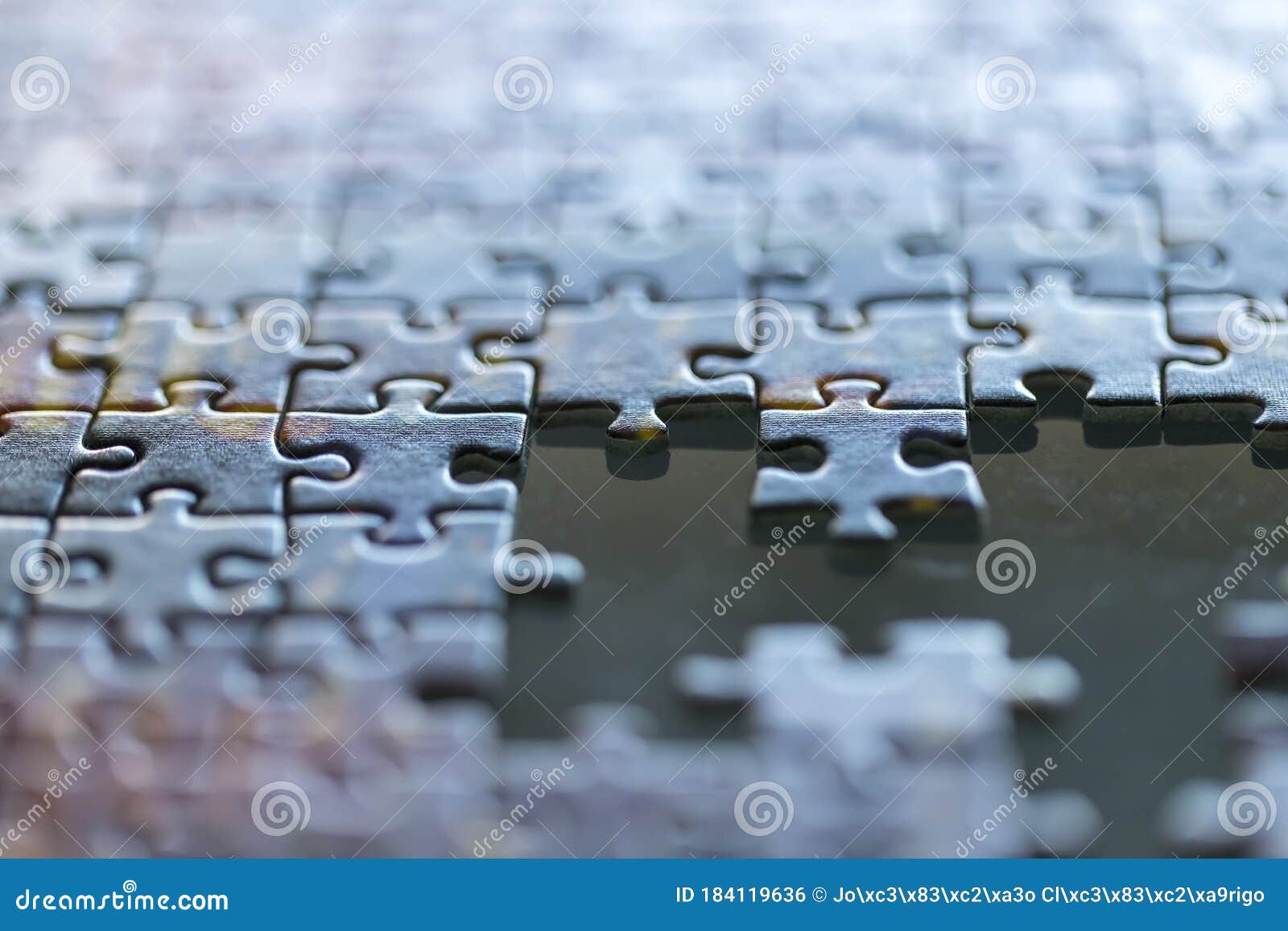 jigsaw incomplete puzzle missing pieces closeup background