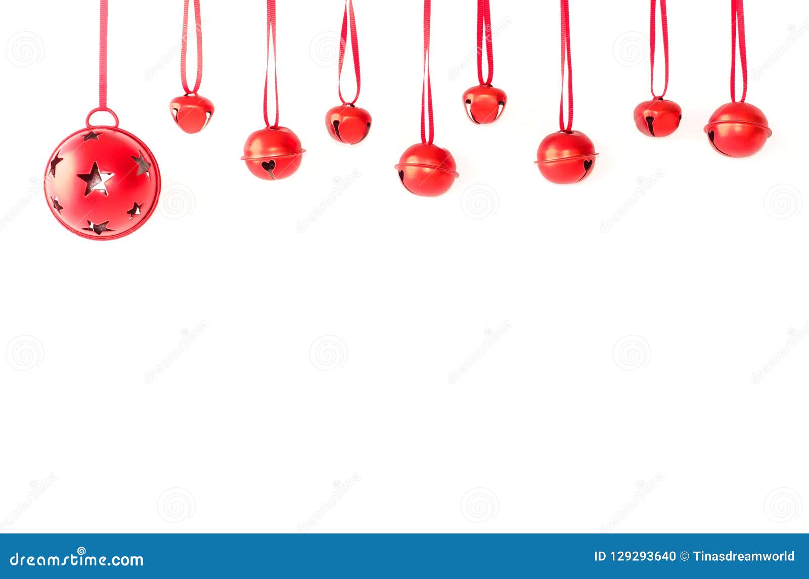 jingle bells with ribbon hanging in front of white background