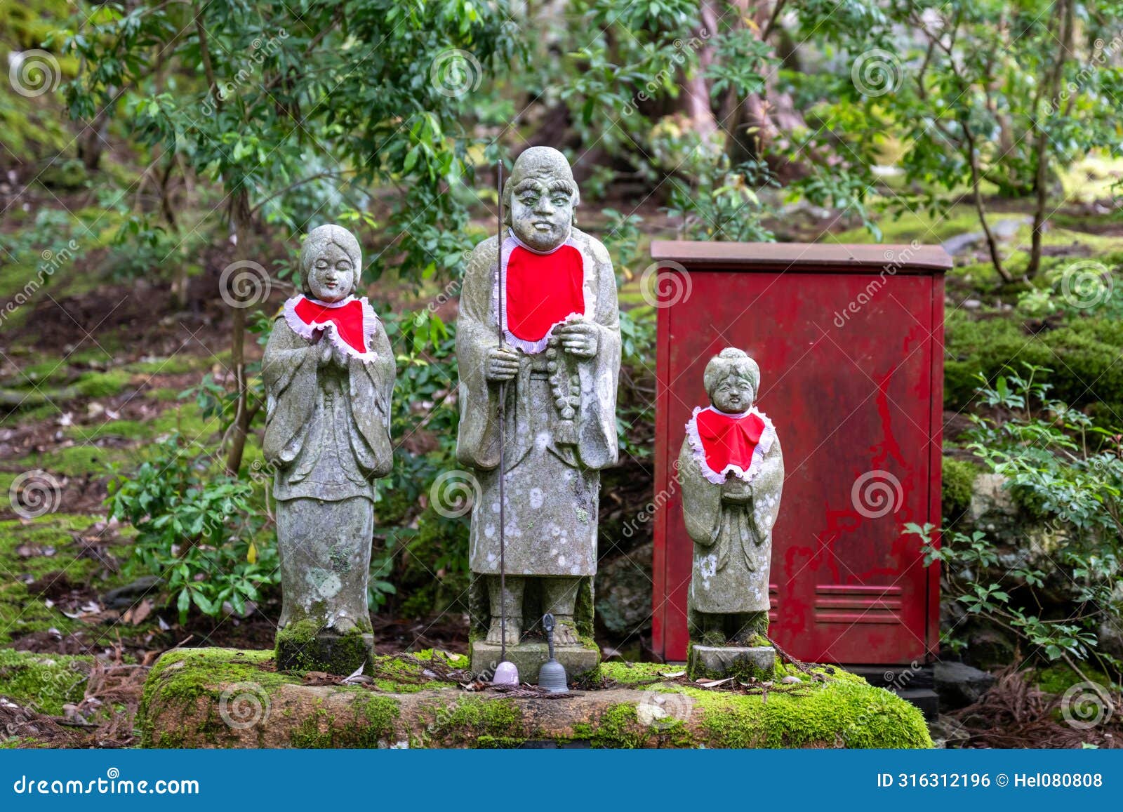 statues of jizo, enlightened monk who is the protector of the dead children in japan. jizo and water-spouting dragon