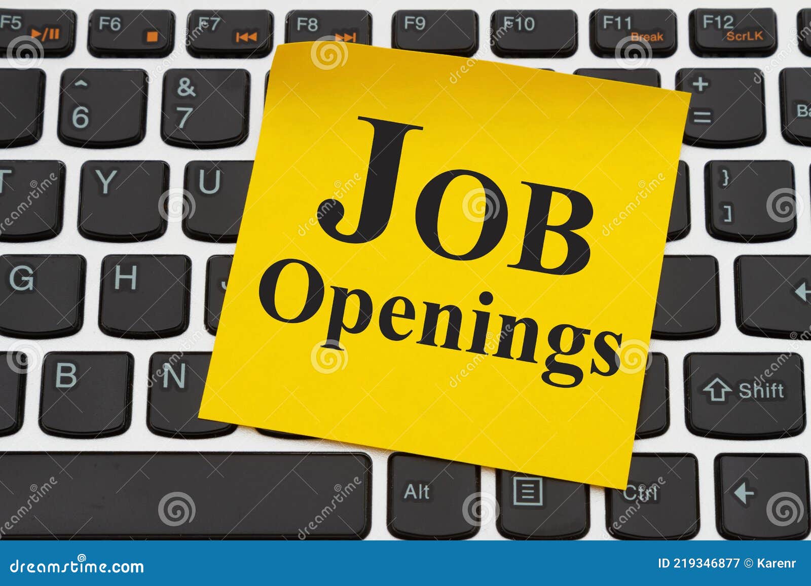 job openings message on yellow sticky note on a keyboard