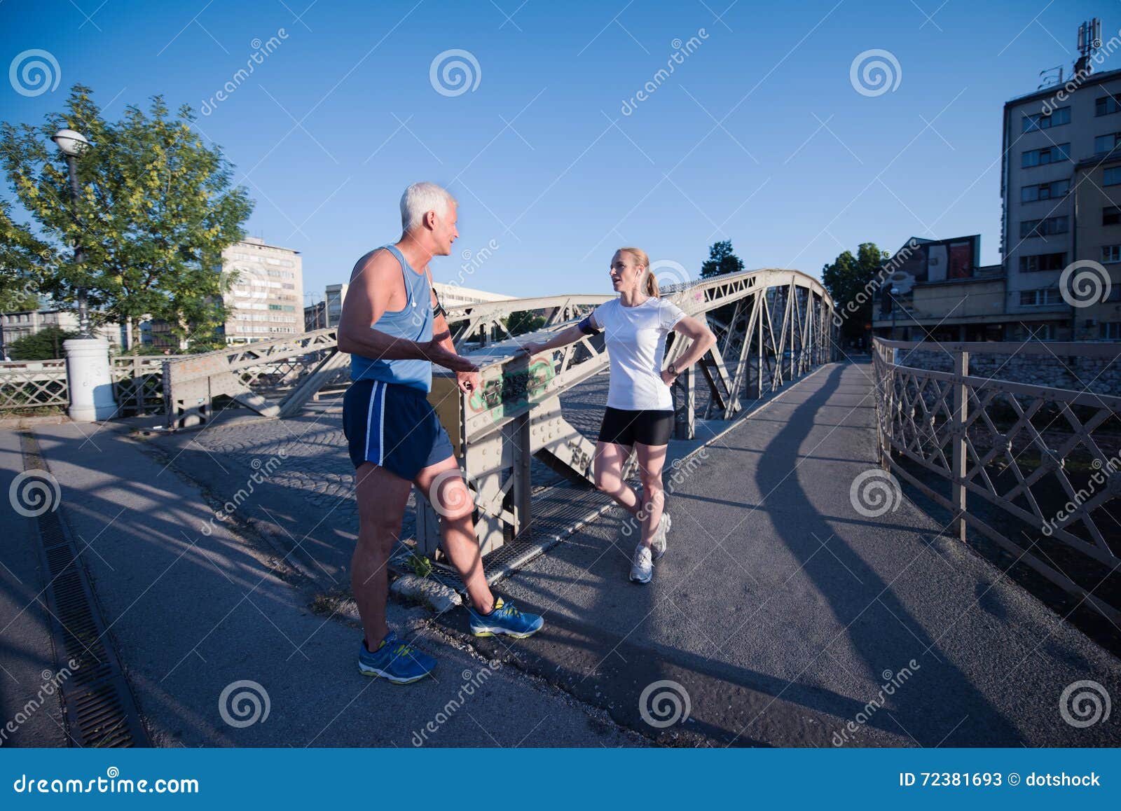 jogging couple planning running route and setting music stock image