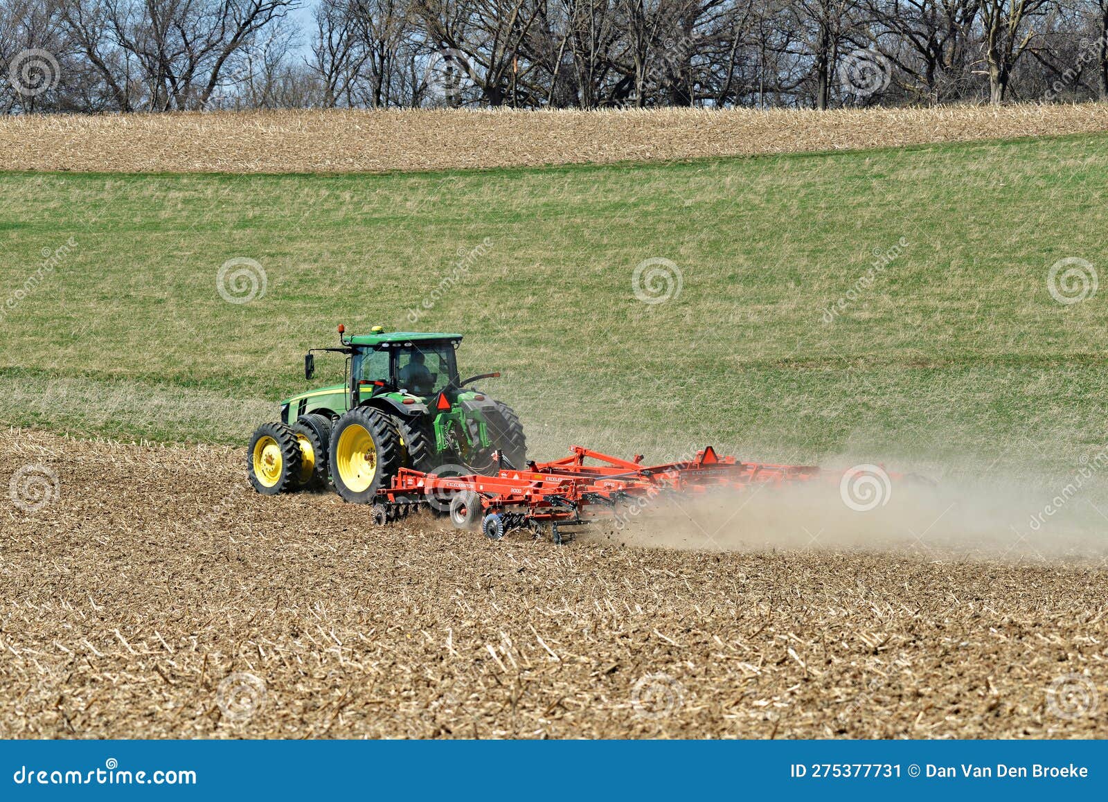 John Deere 8400R Tractor Pulling a Kuhn Excelerator 8000 Tiller