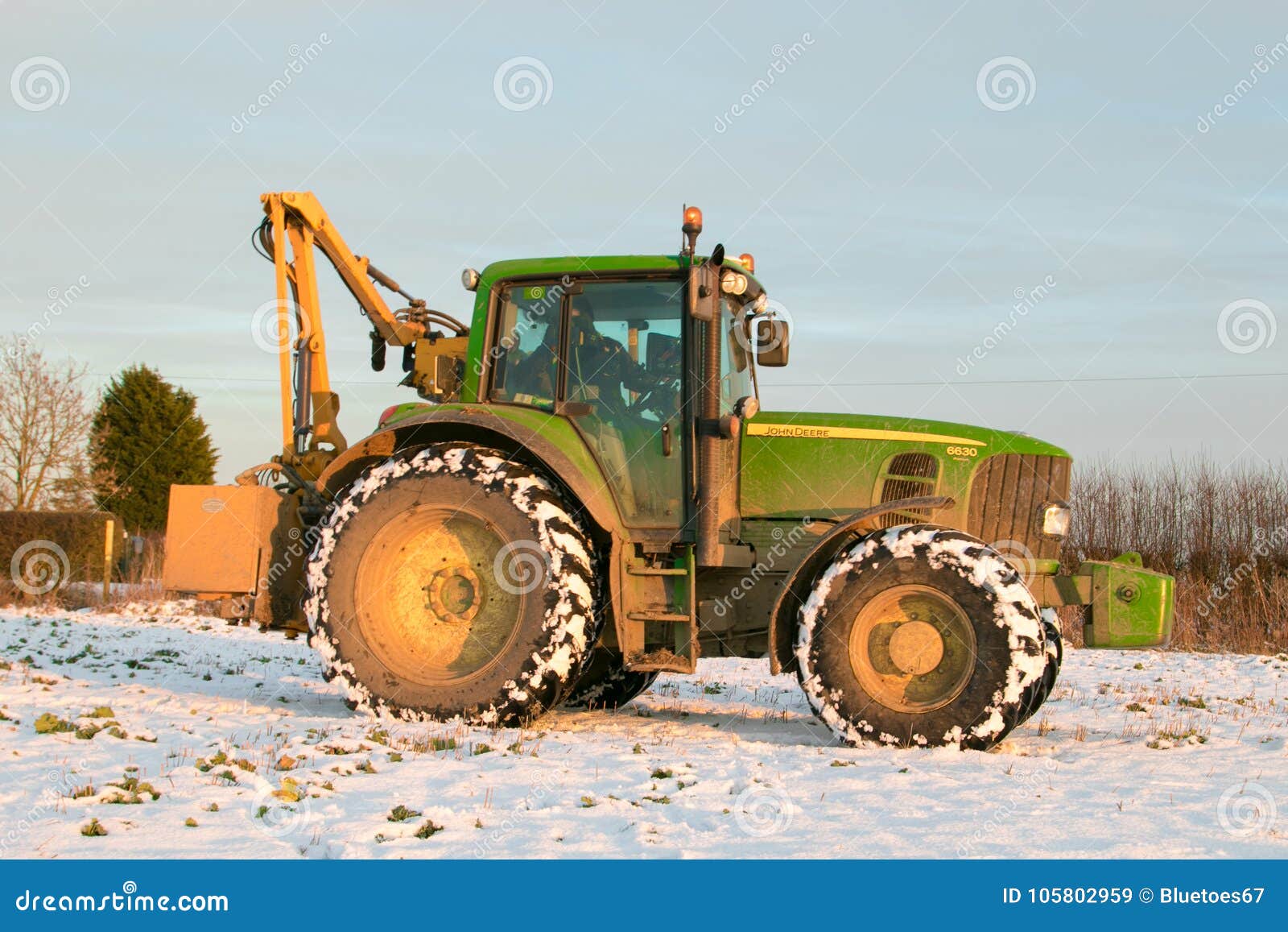 John Deere Tractor Cutting Hedges in Snow Editorial Stock Image Image