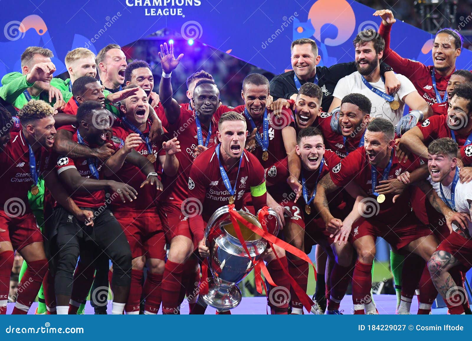 jordan henderson lifting champions league trophy