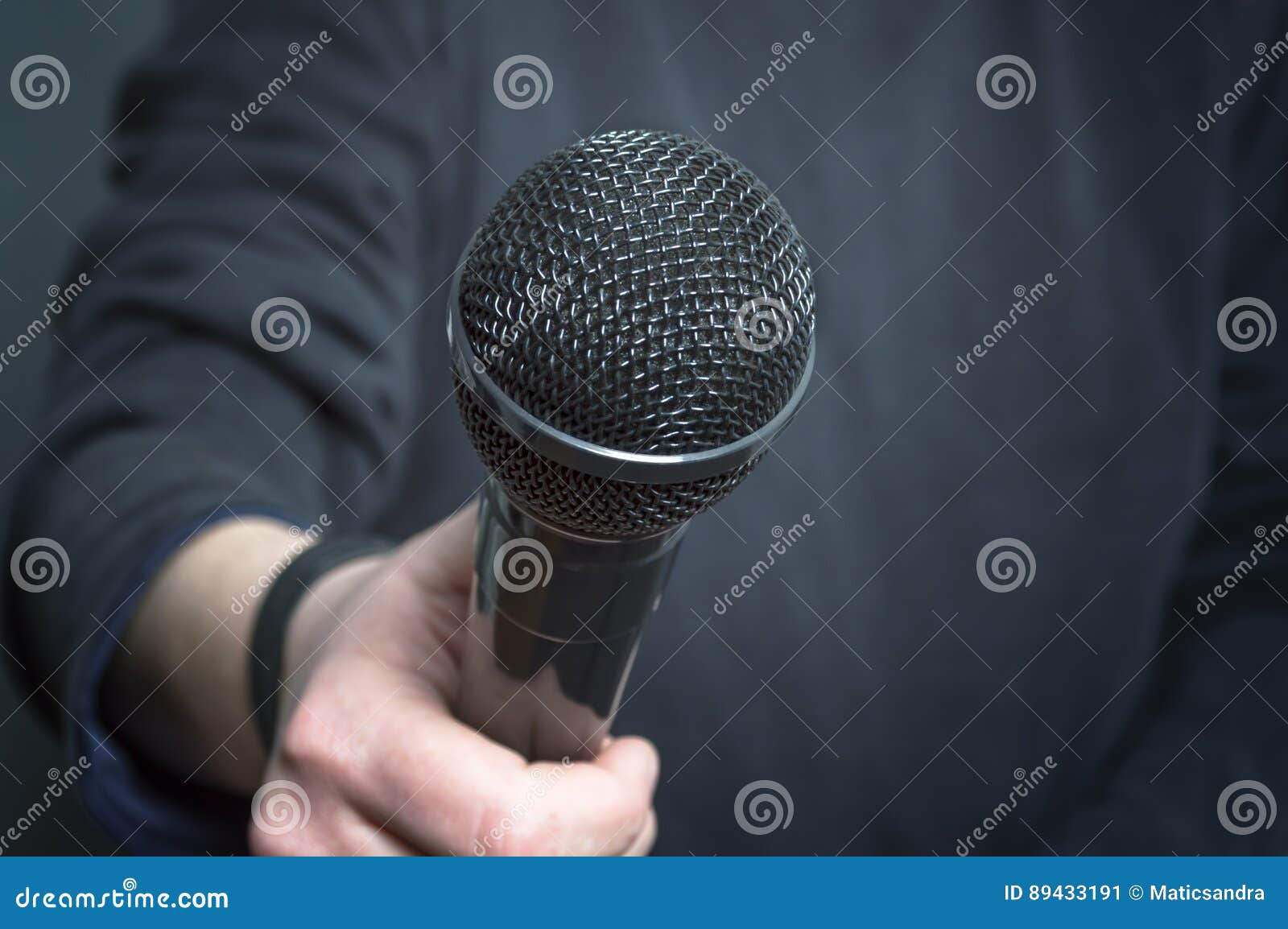 journalist making speech with microphone and hand gesturing concept for interview.