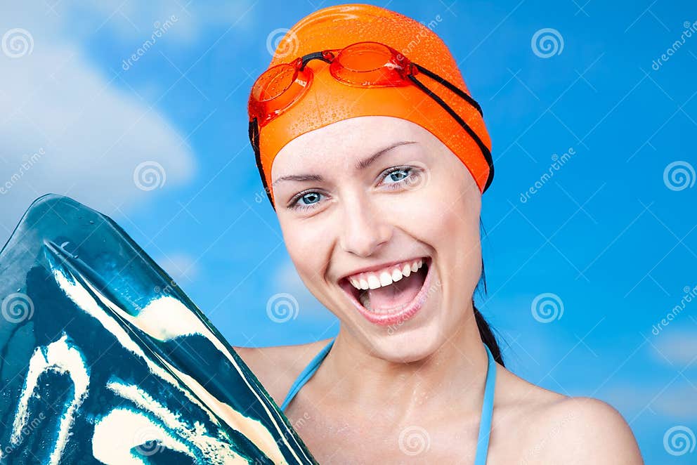 Joy Of A Victory A Winner Young Female Swimmer In An Orange Swimming Cap And With Swimming