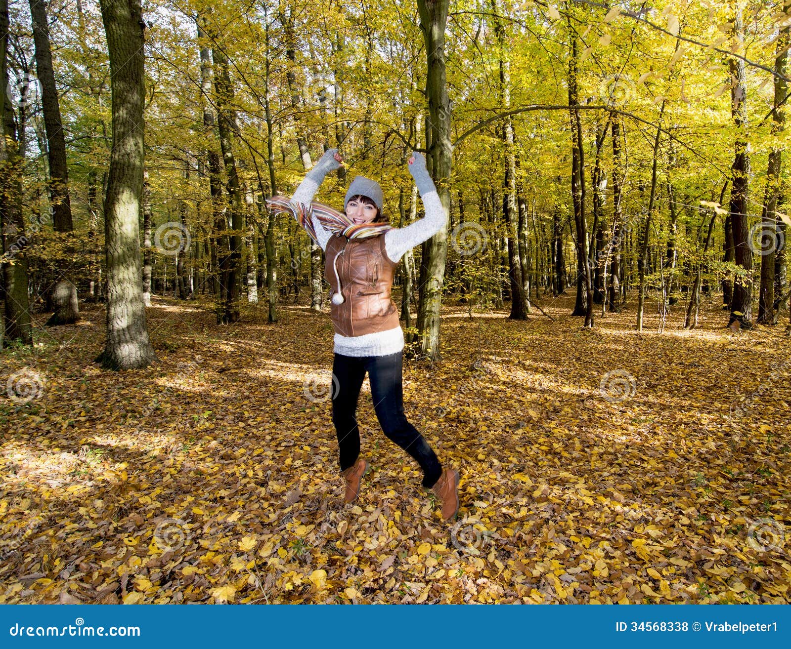 Joyful Caucasian Woman Jumping In The Autumn Leaves Stock Photo Image