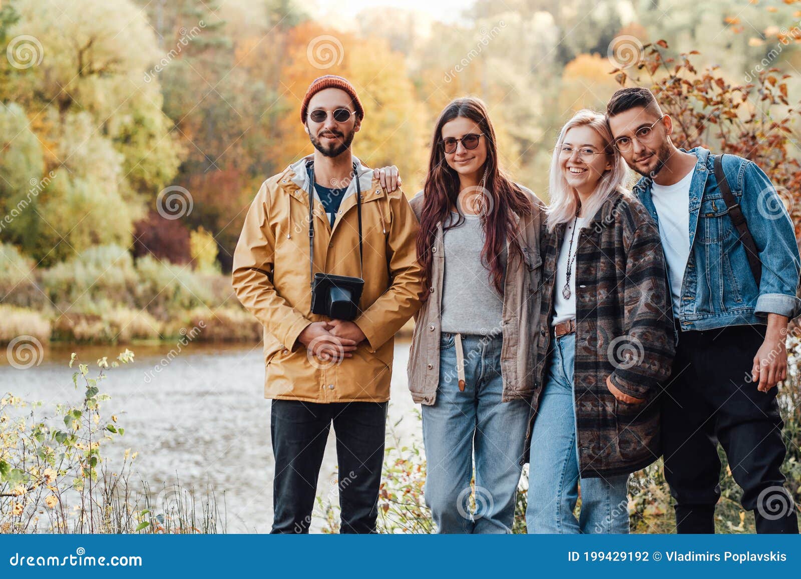 Company of Four Friends Walking in Autumn Forest Stock Photo ...