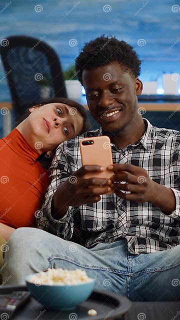 Joyful Interracial Couple Taking Selfies With Smartphone Stock Image