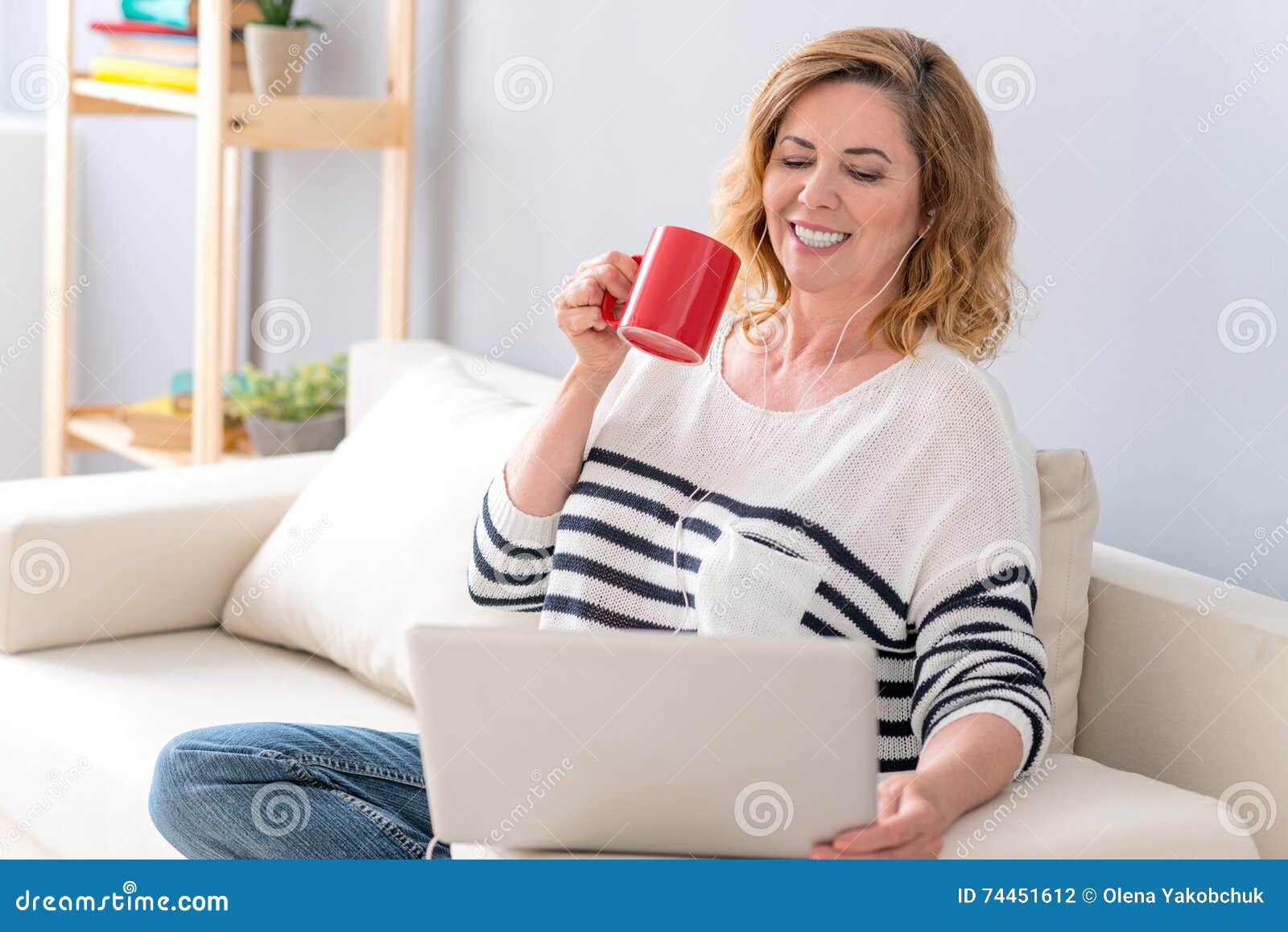 Joyful Mature Lady Watching Movie on Computer Stock Ph picture