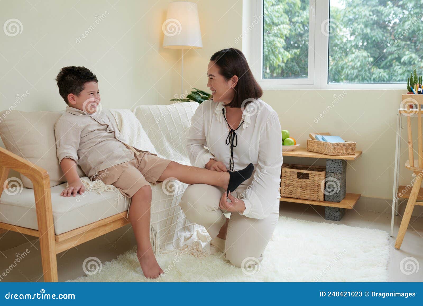 Mother Helping Son Changing Clothes Stock Image - Image of dress, home 