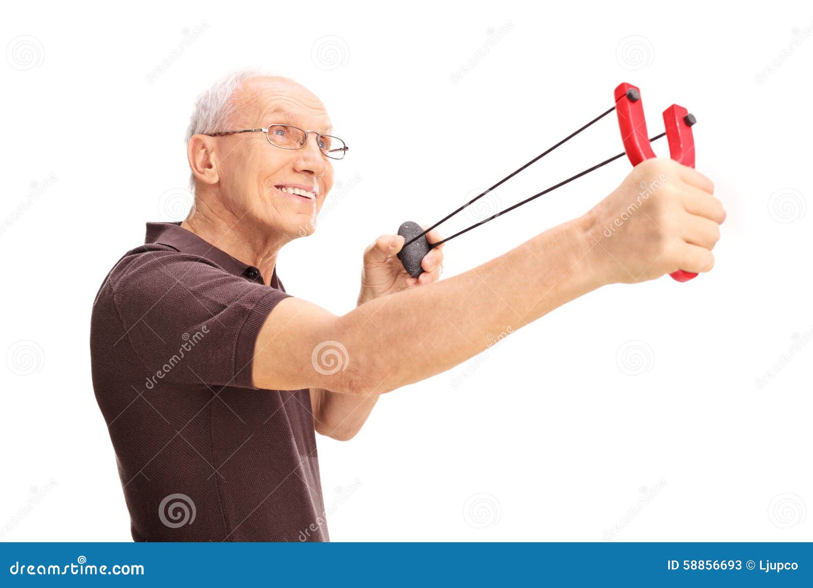 joyful-senior-man-shooting-slingshot-profile-shot-smiling-isolated-white-background-58856693.jpg