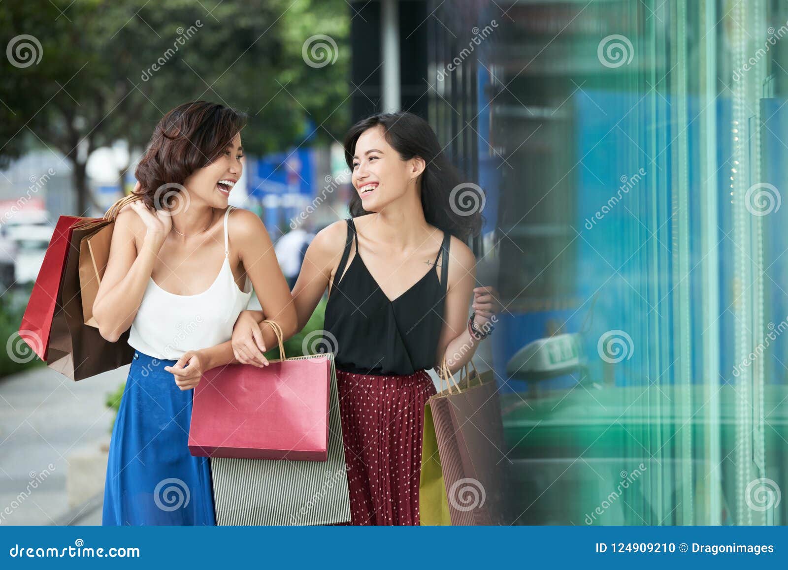 Joyful shopping girls stock photo. Image of paperbags ...