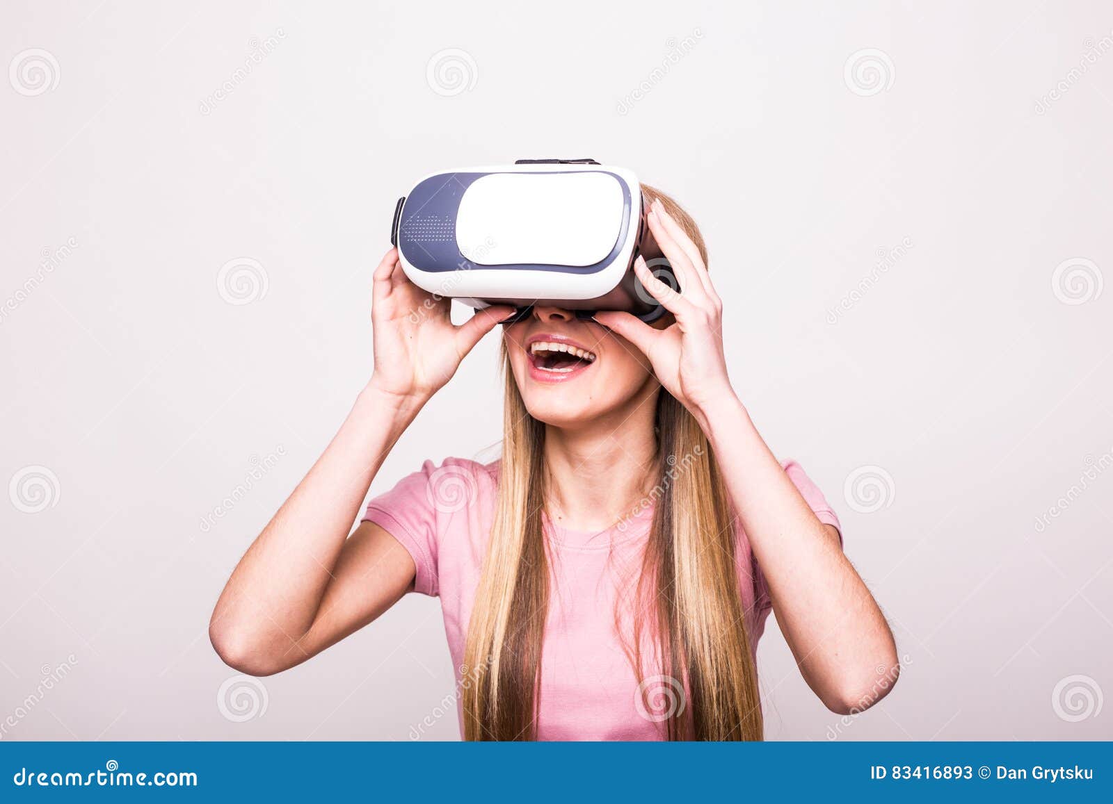 Joyful Young Girl Using A VR Headset And Smiling Stock 