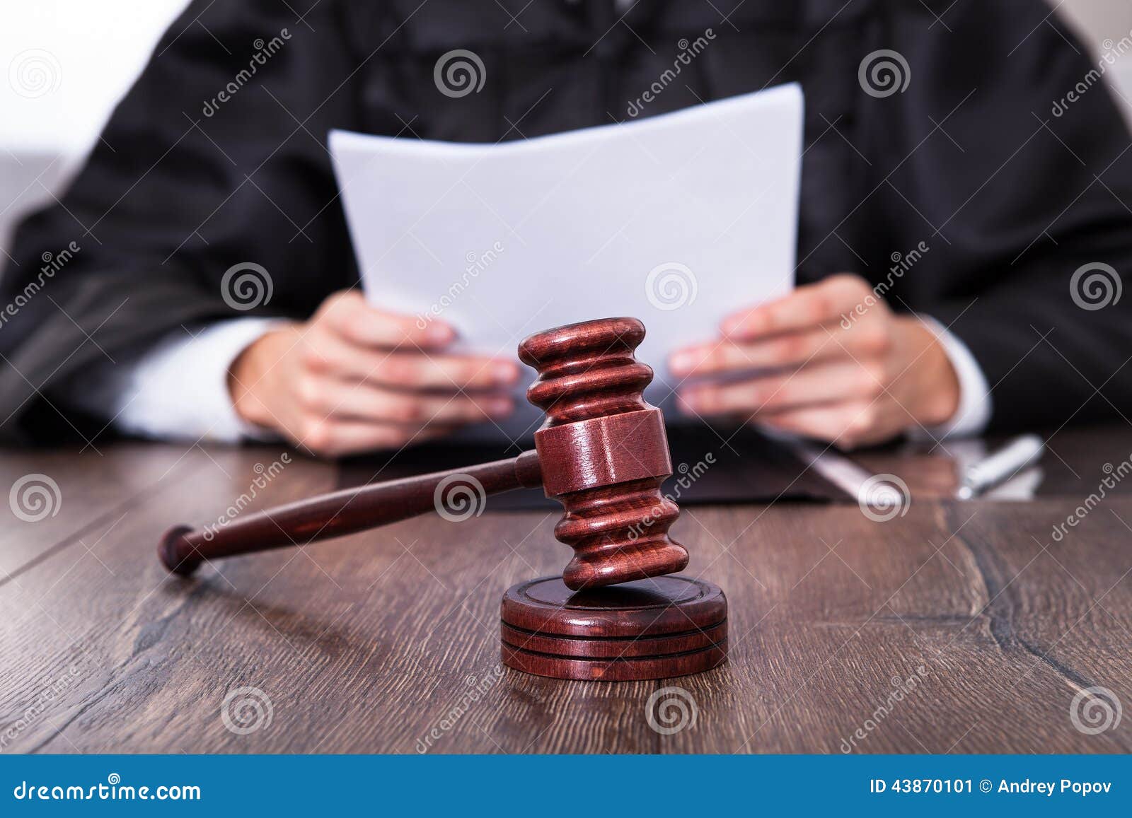 judge holding documents