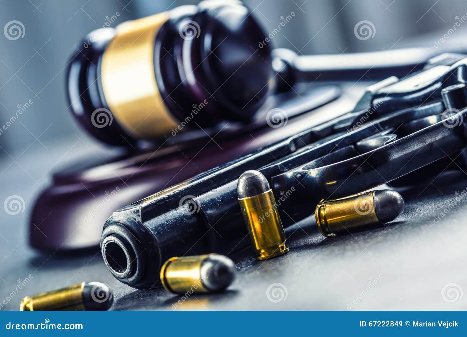 judge's hammer gavel. justice and gun. justice and the judiciary in the unlawful use of of weapons. judgment in murder