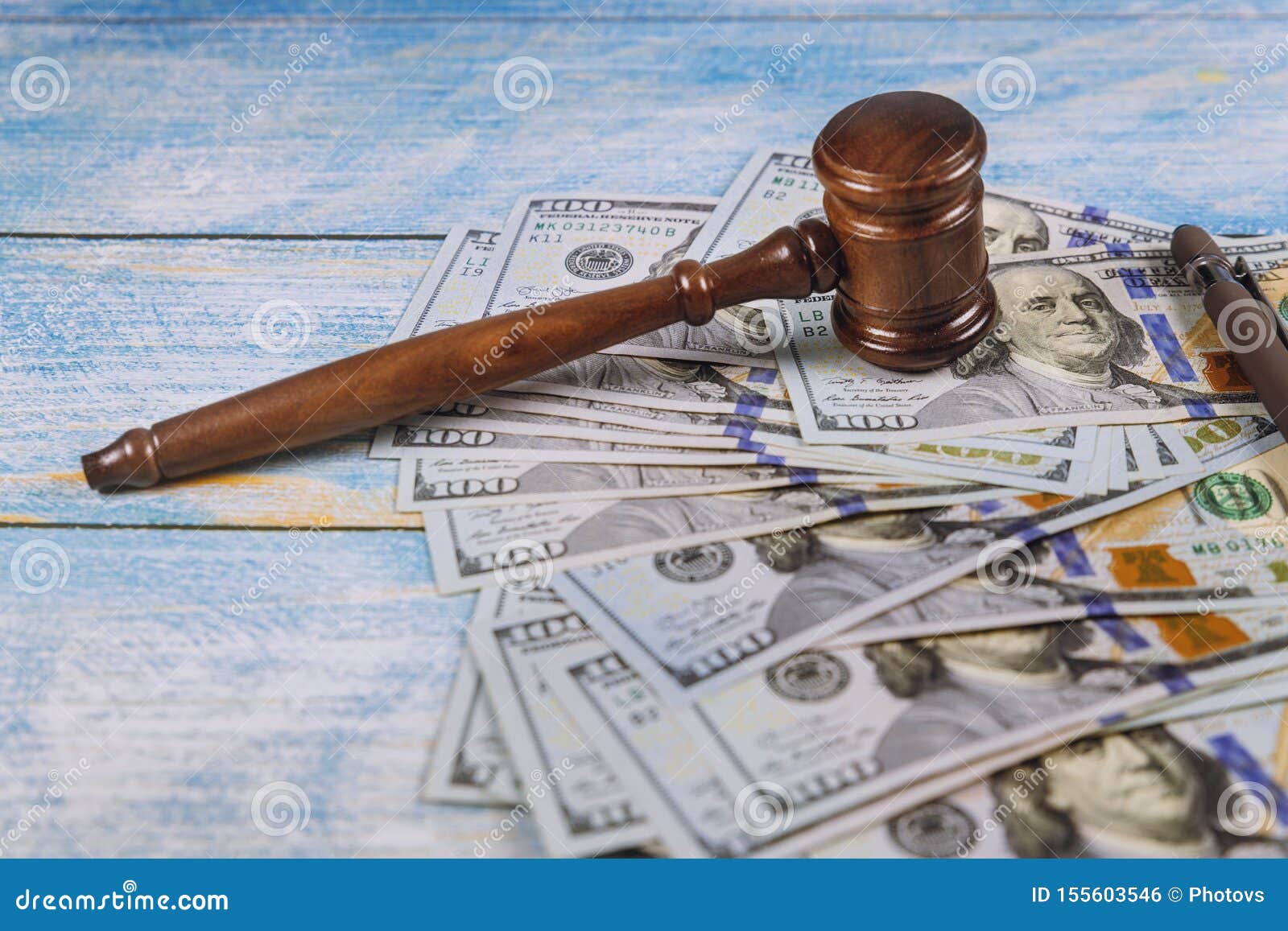 the judge& x27;s gavel, banknotes of american dollars on the business, finance corruption money financial crime
