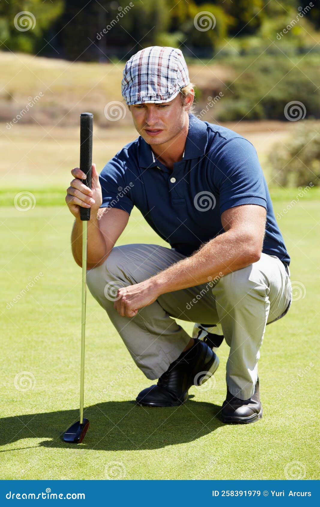 Judging the Lay of the Green. a Golfer Eyeing Up a Long Putt. Stock ...