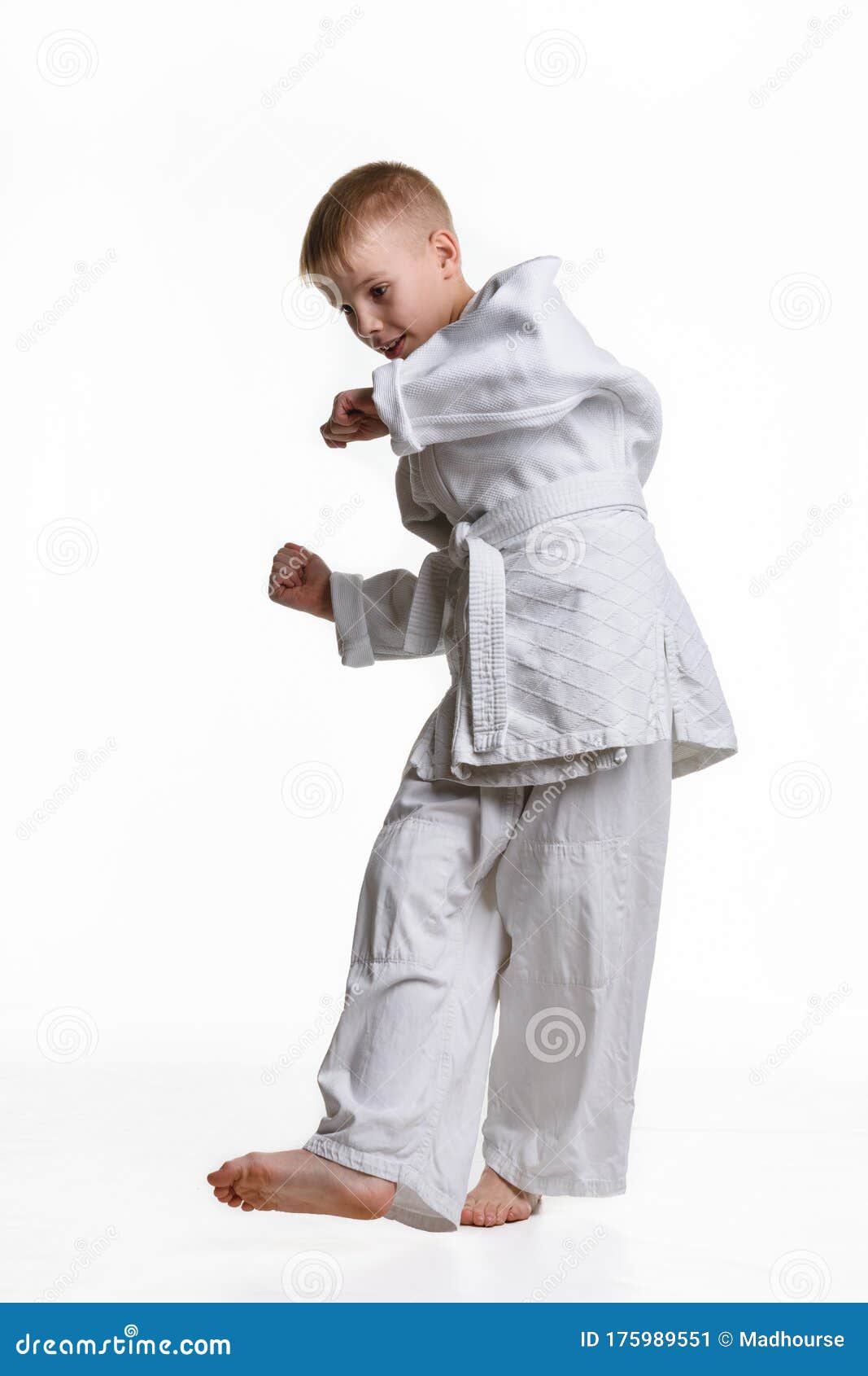 judo boy practicing to do a sweep