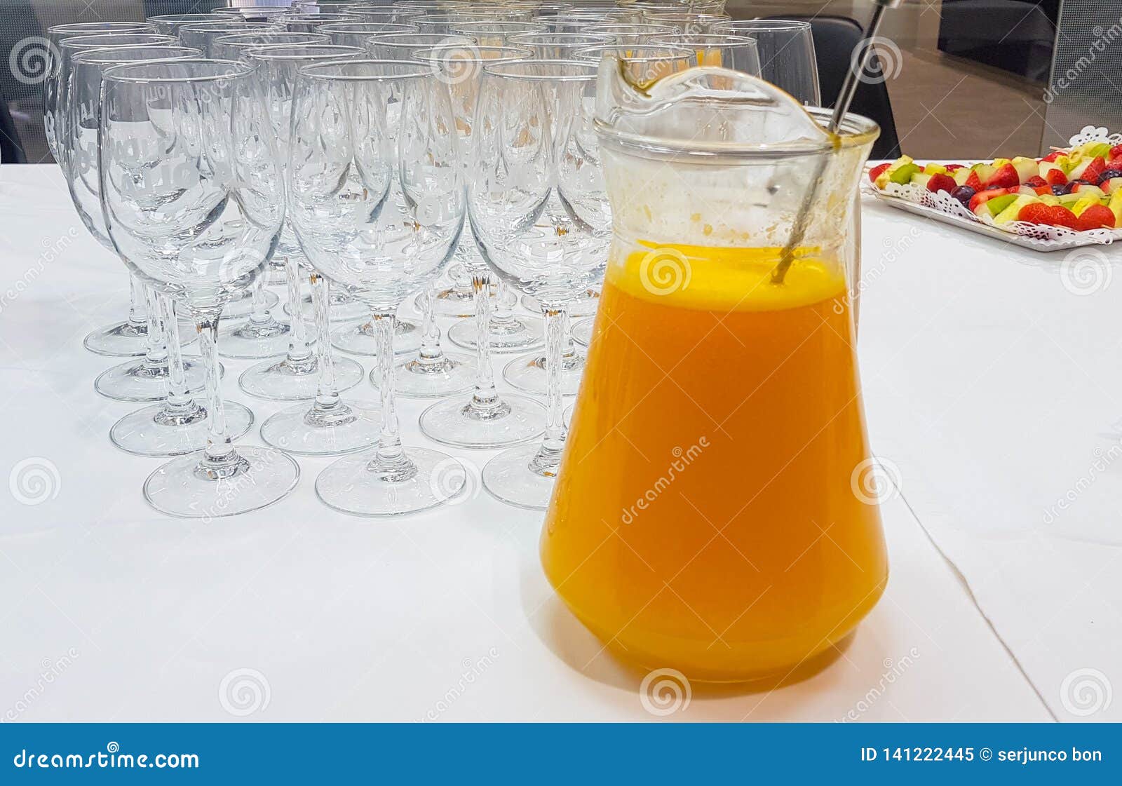 Jug of Orange Juice with Bottom Glasses Ready To Serve Stock Image