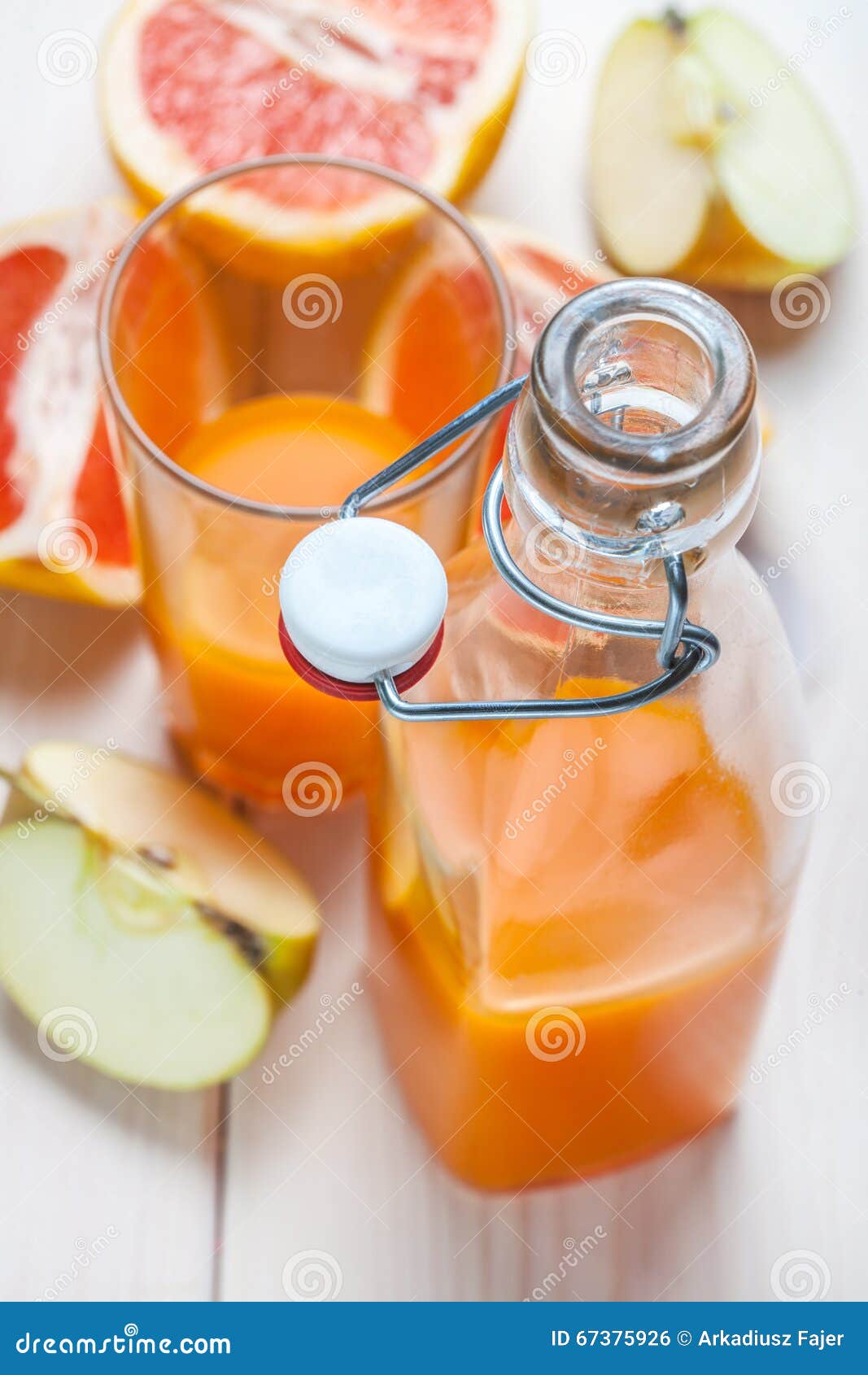 Juice of Apples and Red Grapefruit. Stock Photo Image of season