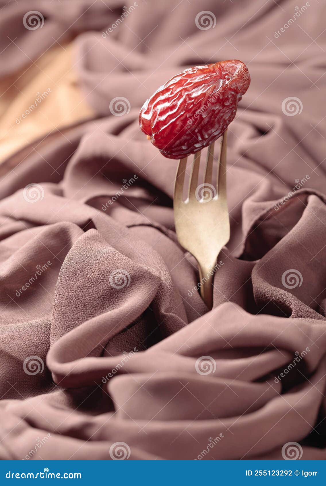 Juicy date on a fork stock photo. Image of fresh, brown - 255123292