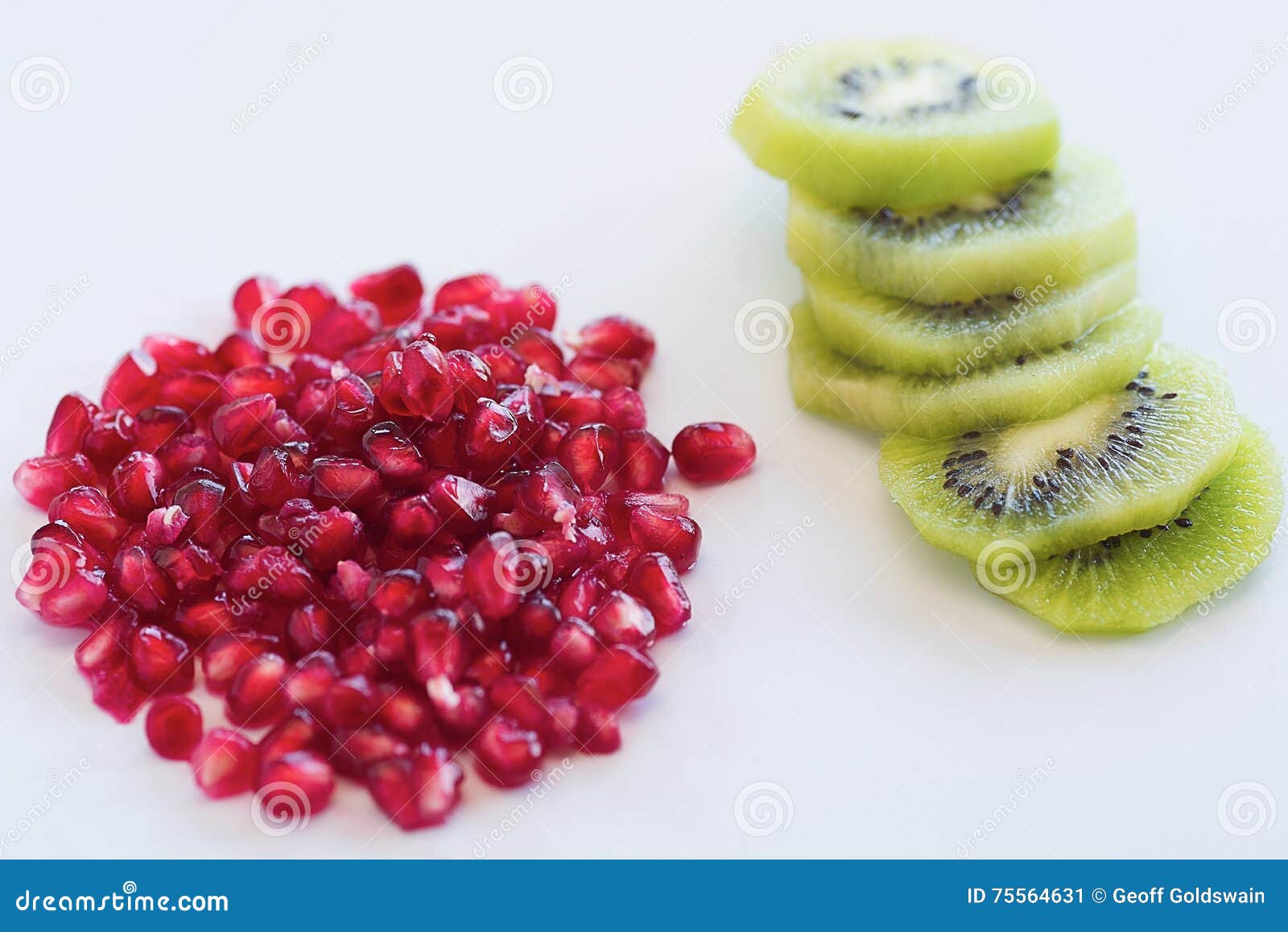 Juicy Pomegranate with Kiwi Fruit and Slices on White Background with