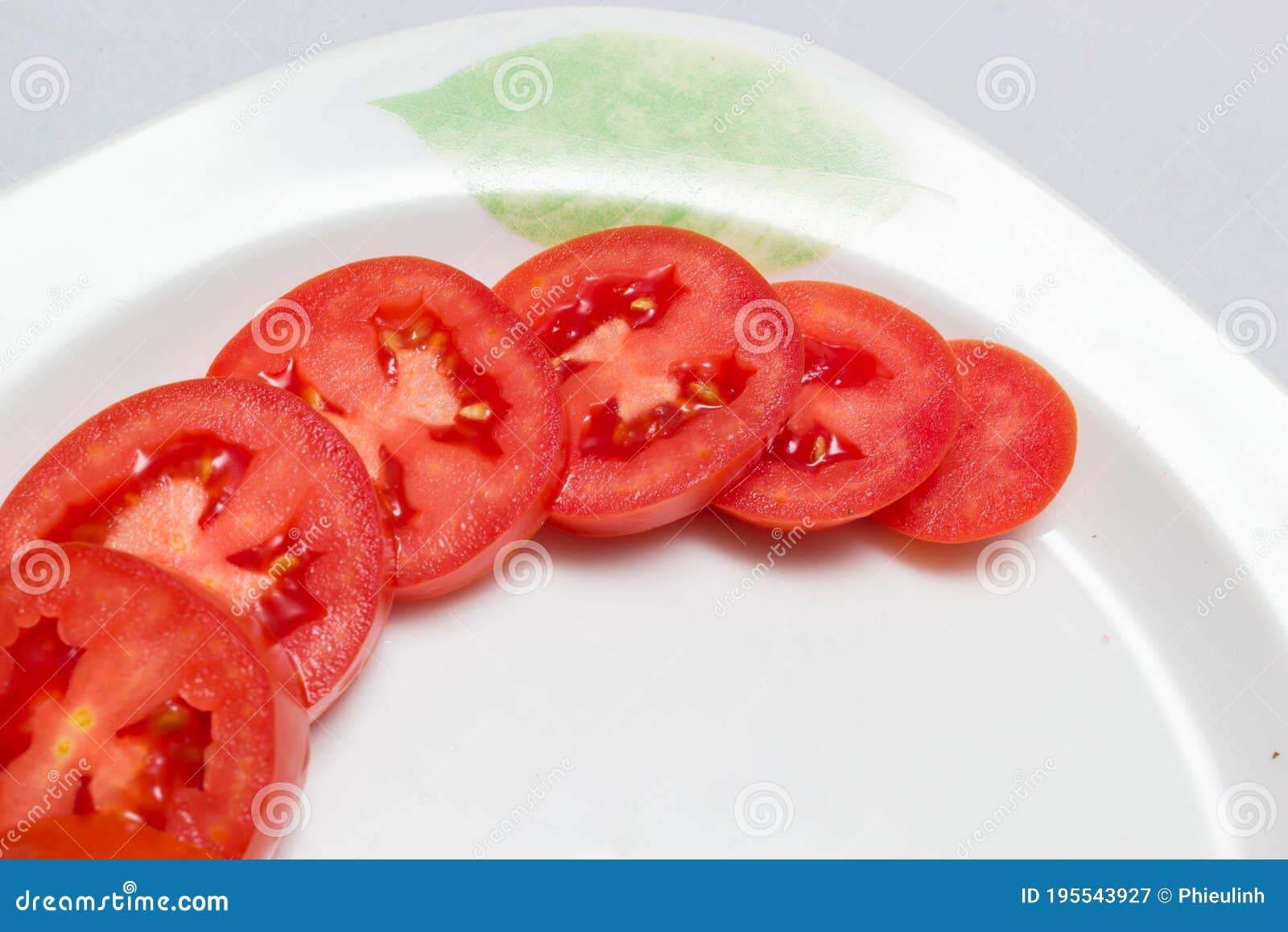 juicy red tomatoes in table cloth . caro background