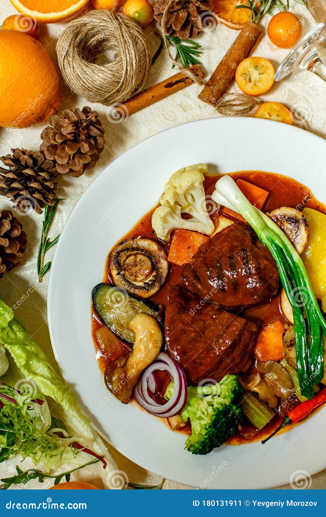 Juicy Steaks with Grilled Broccoli Vegetables and Mushrooms Served on the Table Stock Image
