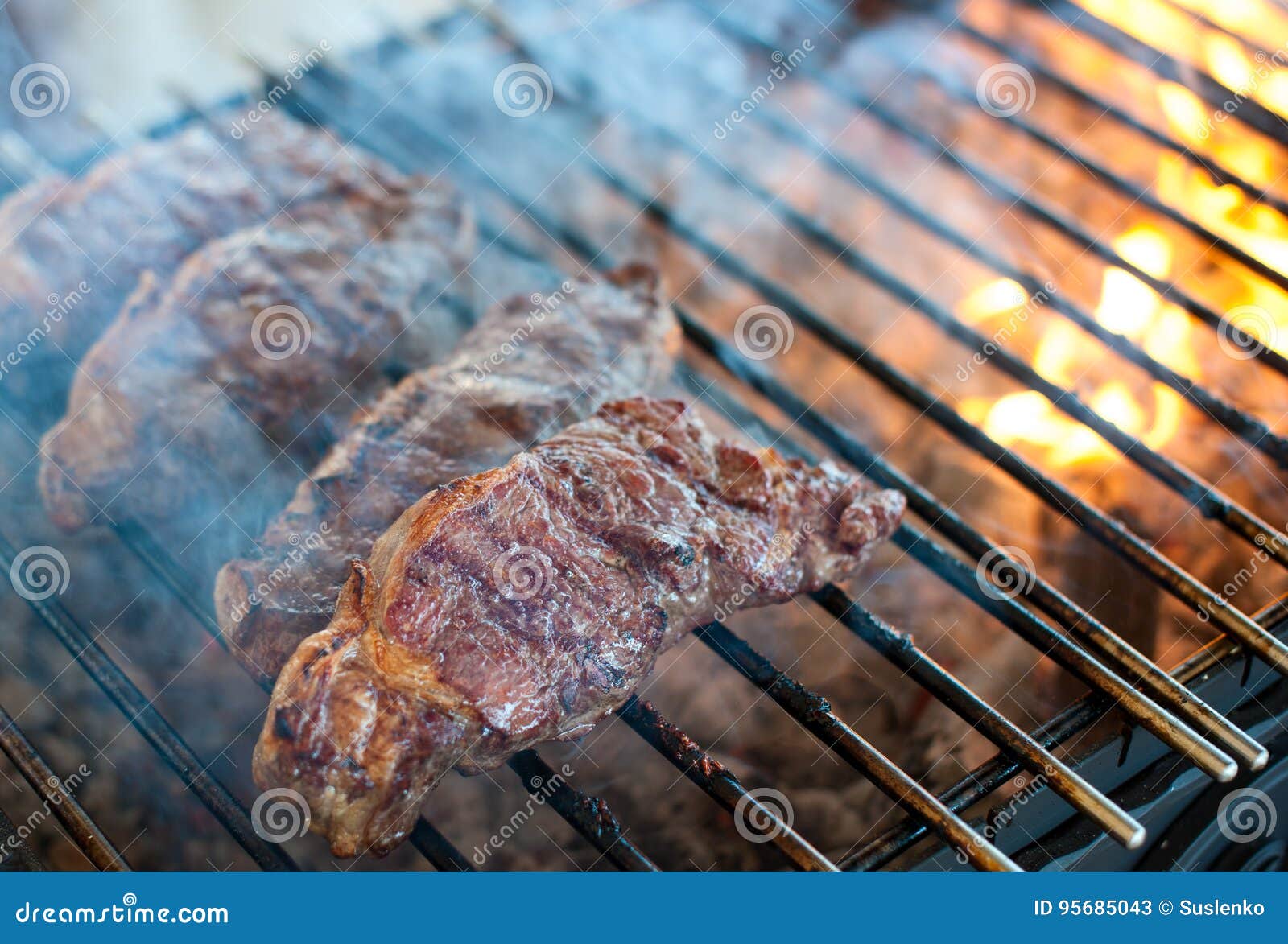 Juicy Steaks from Marbled Veal are Roasted on a Grill Stock Image