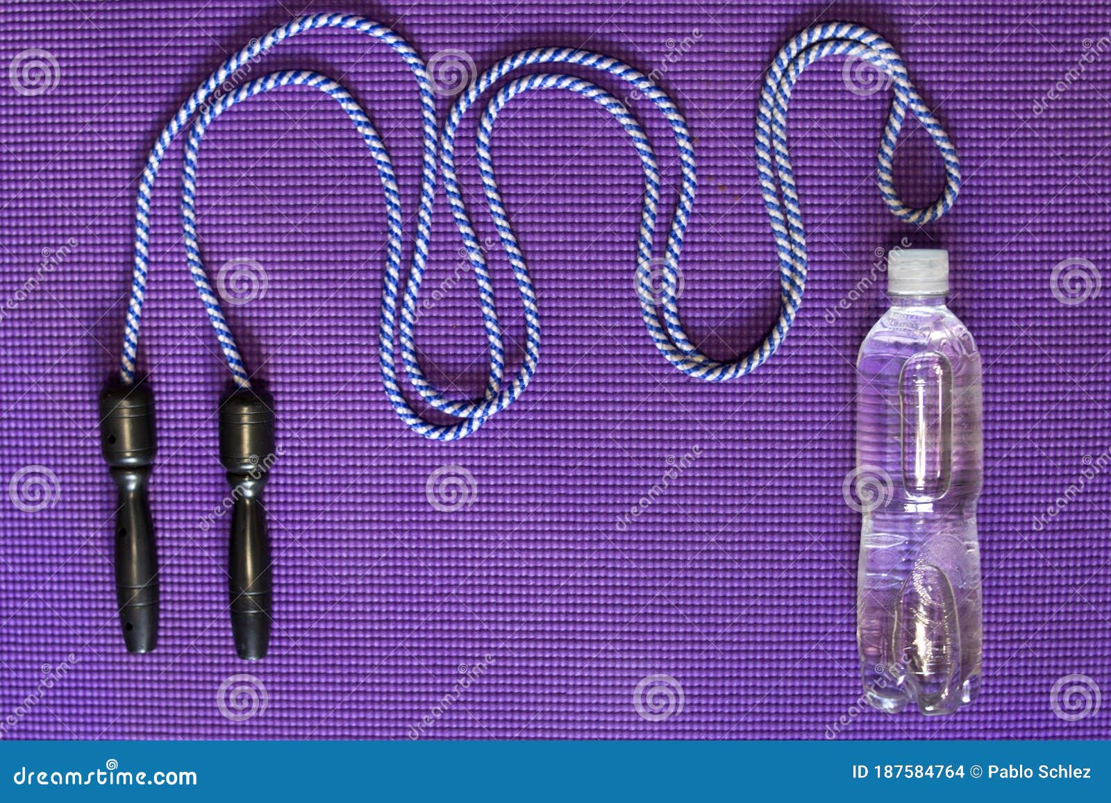 Jump Rope and Bottle of Water on Violet Mat Stock Photo Image of routine, rope 187584764