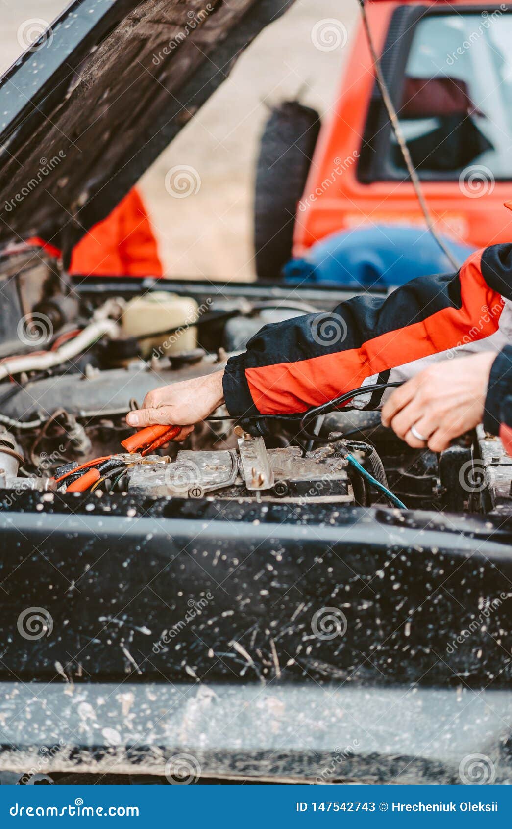JumpStarting the Dead Battery Using Jumper Electrical Wires. Stock
