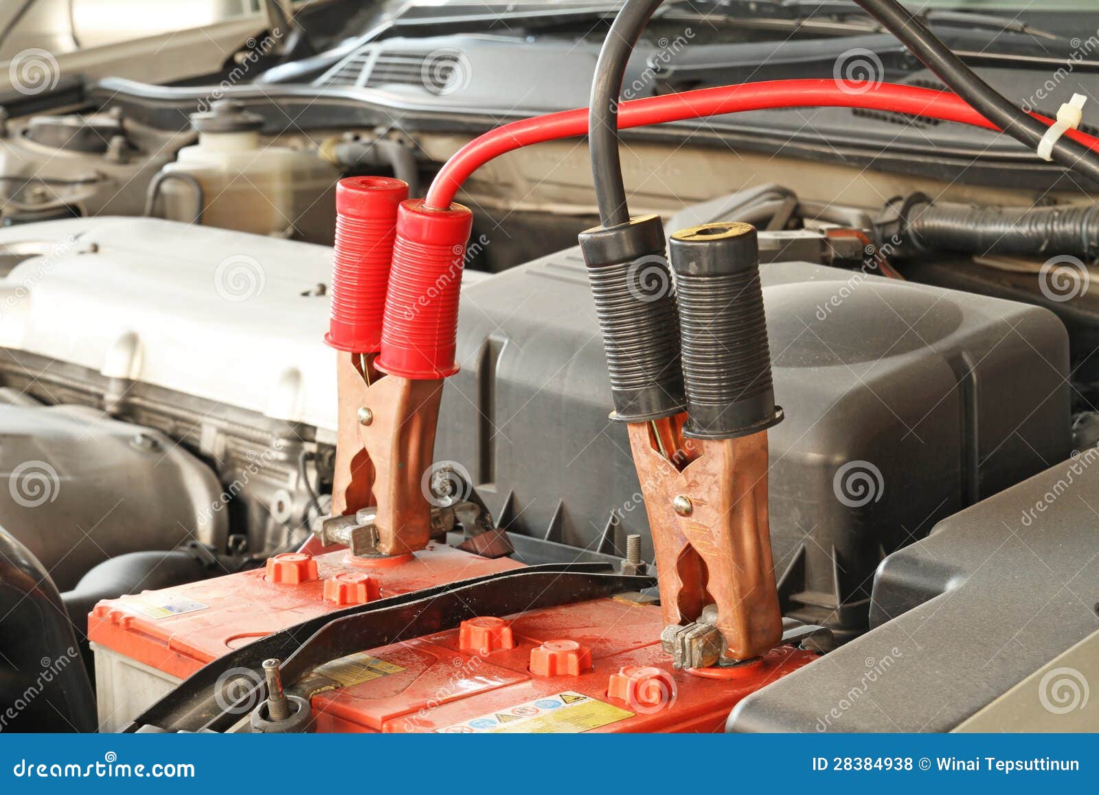 jumper cables on a car
