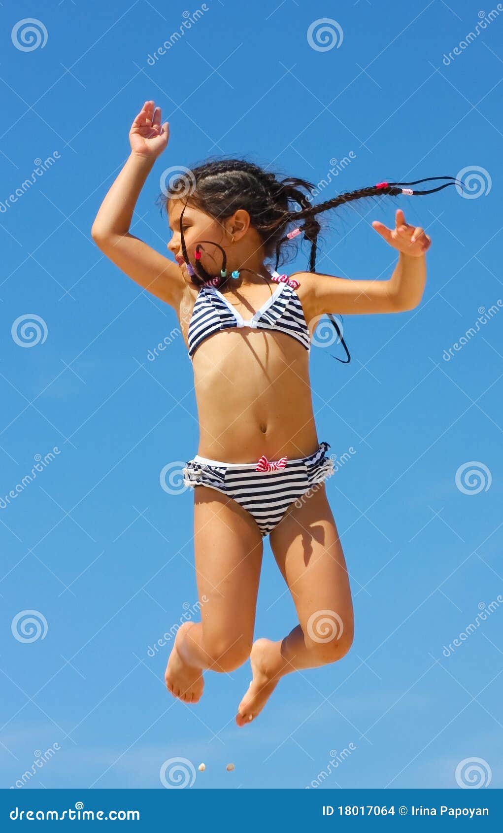 jumping-girl-against-blue-sky-