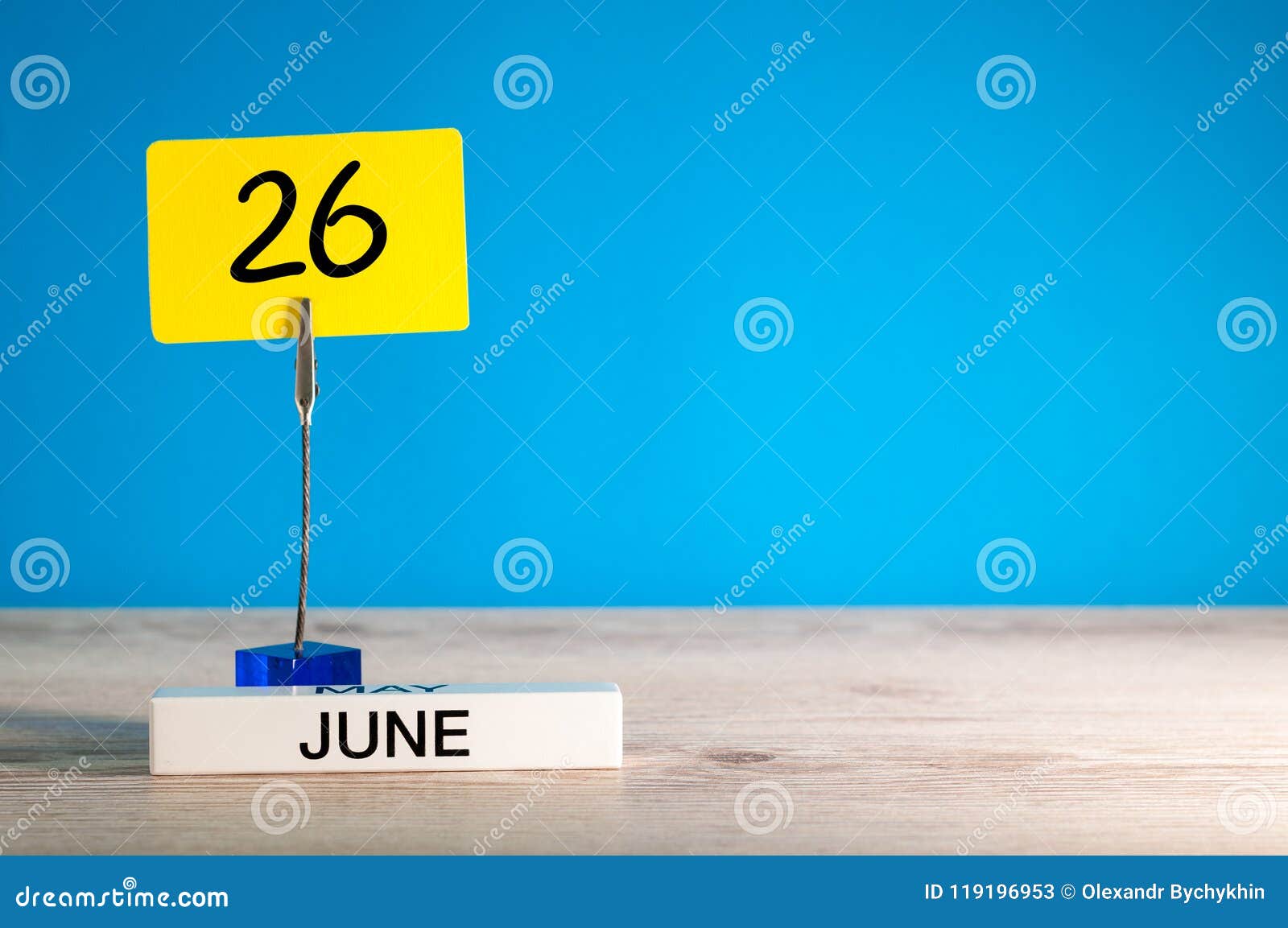 June 26th. Day 26 of June Month, Calendar on Table with Blue Background