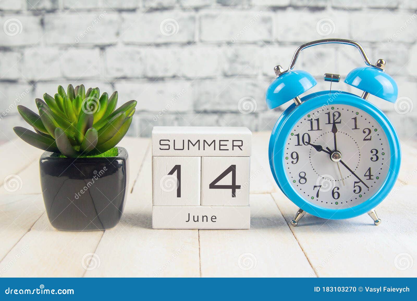 june 14 on the wooden calendar.the fourteenth day of the summer month, a calendar for the workplace. summer