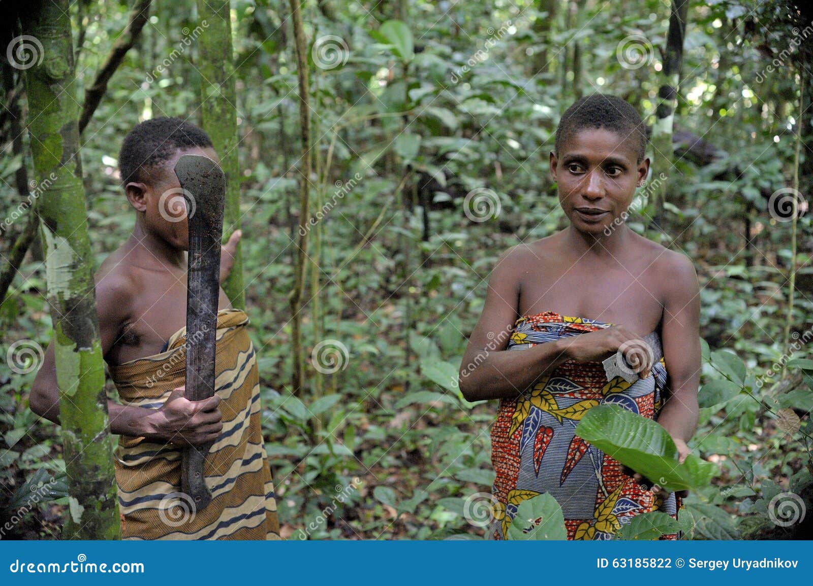 a female tribal warrior in the jungle, african. By