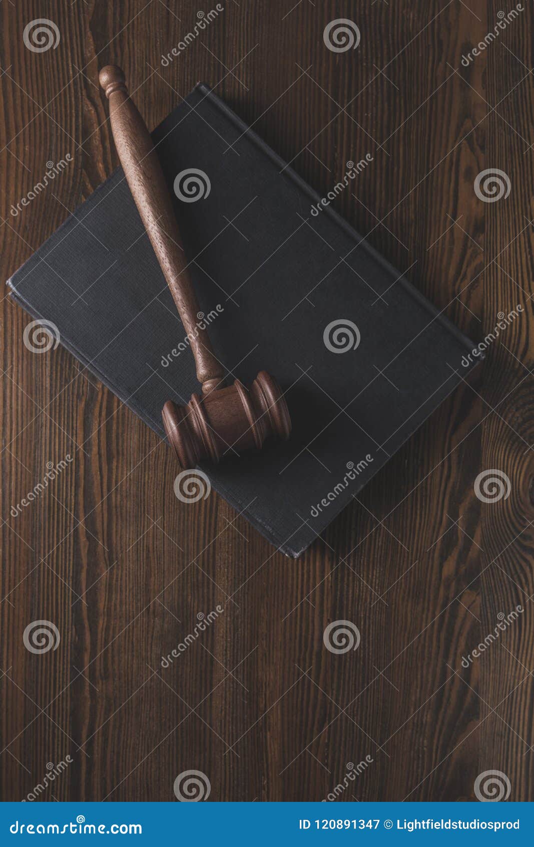 juridical book with hammer on wooden table,