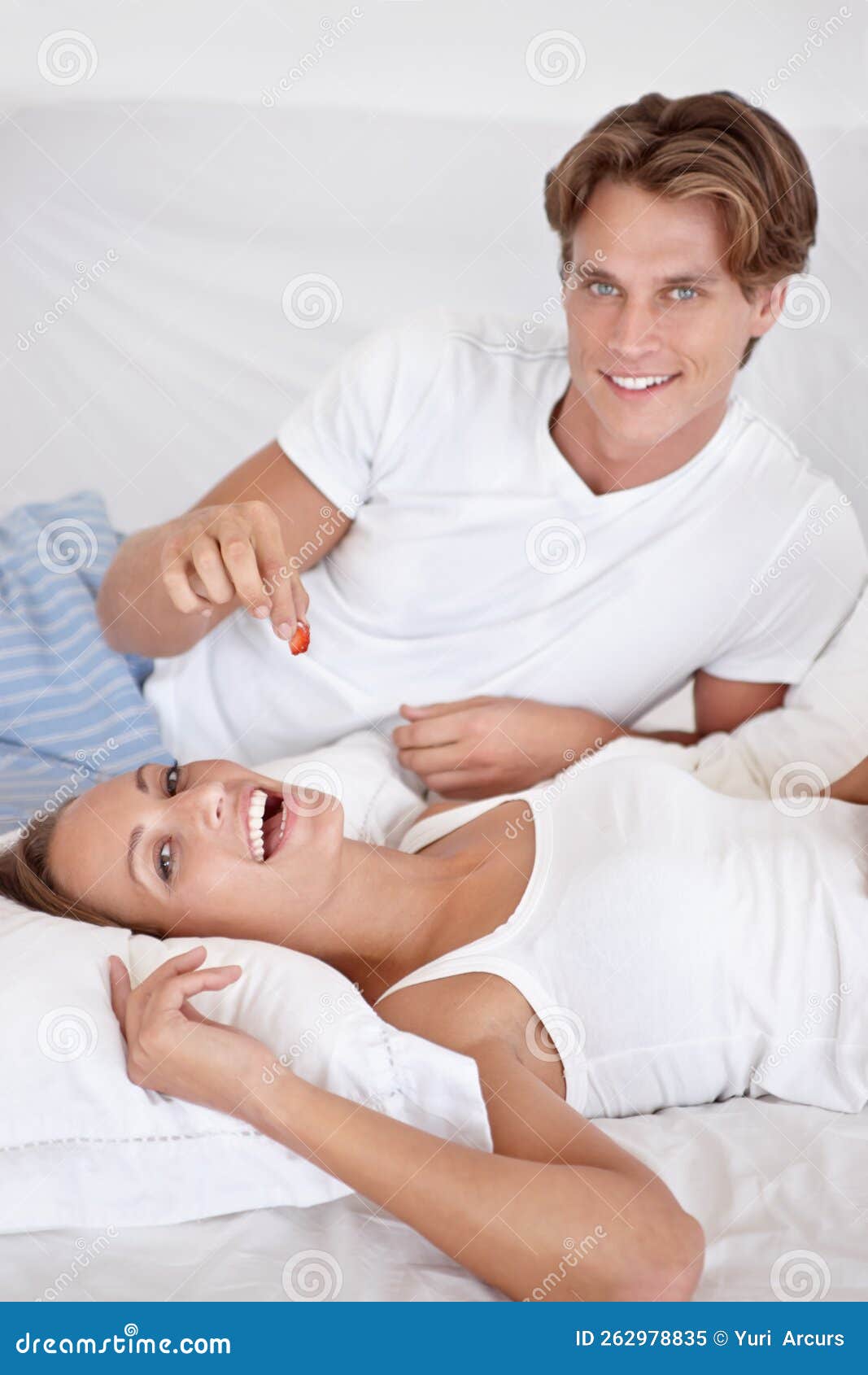 Just One Morea Happy Young Couple Eating Berries In Bed Together Stock Image Image Of 