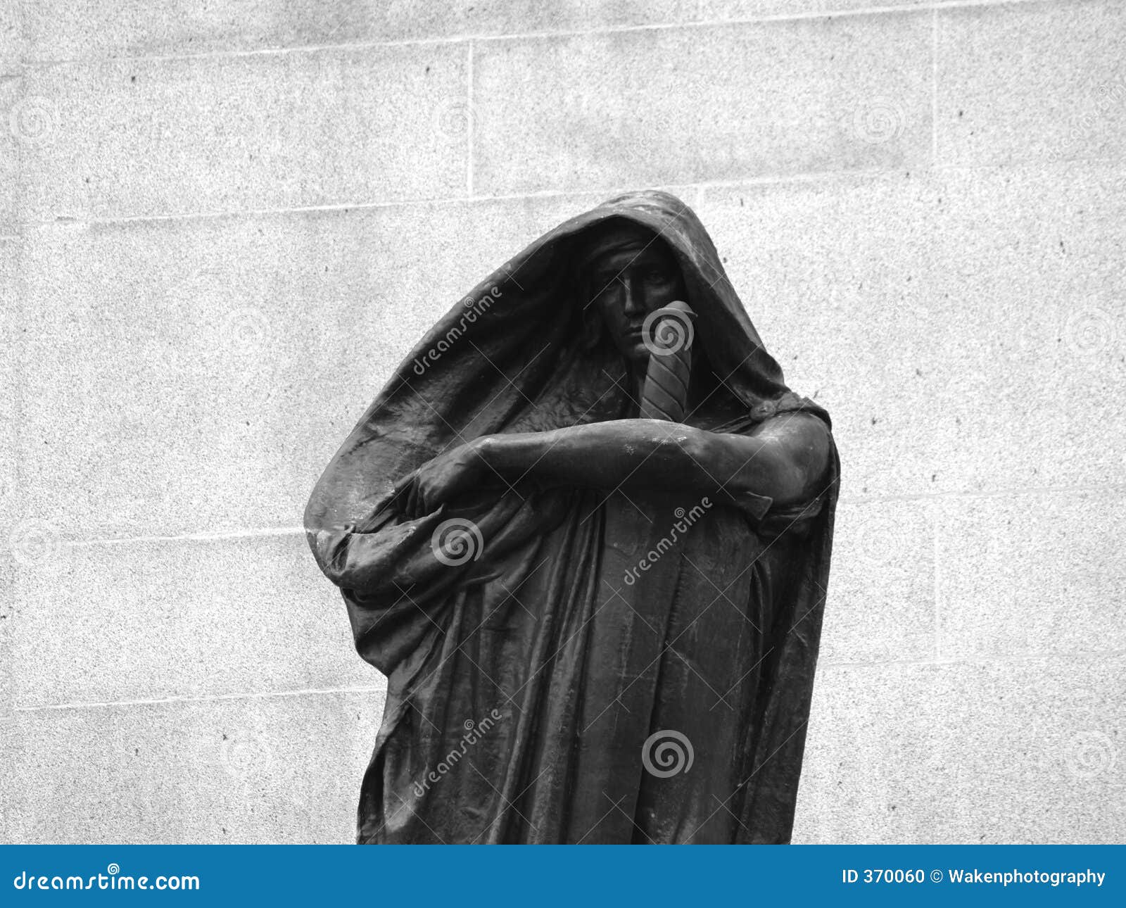 cloaked figure statue