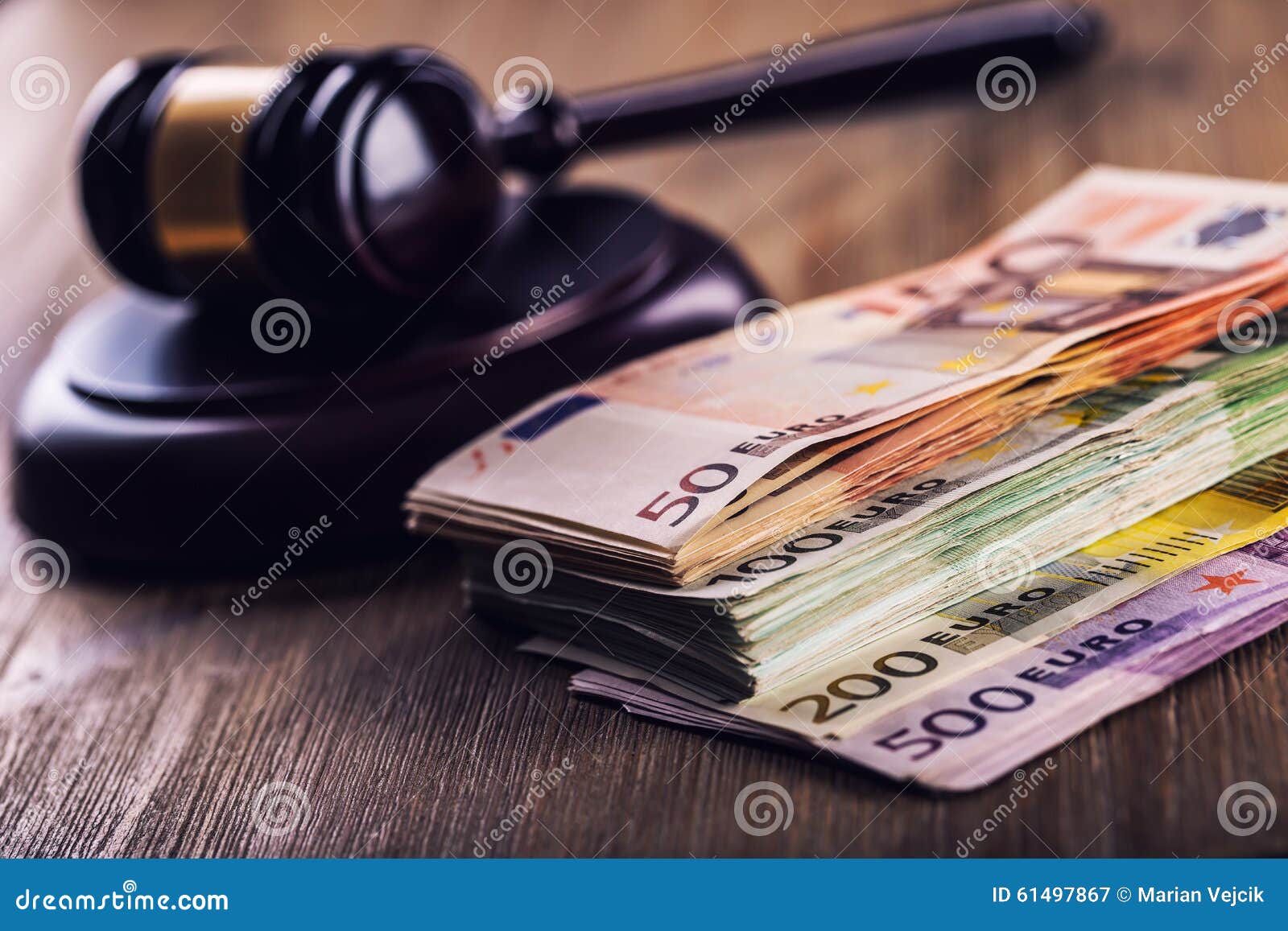 justice and euro money. euro currency. court gavel and rolled euro banknotes. representation of corruption and bribery in the judi