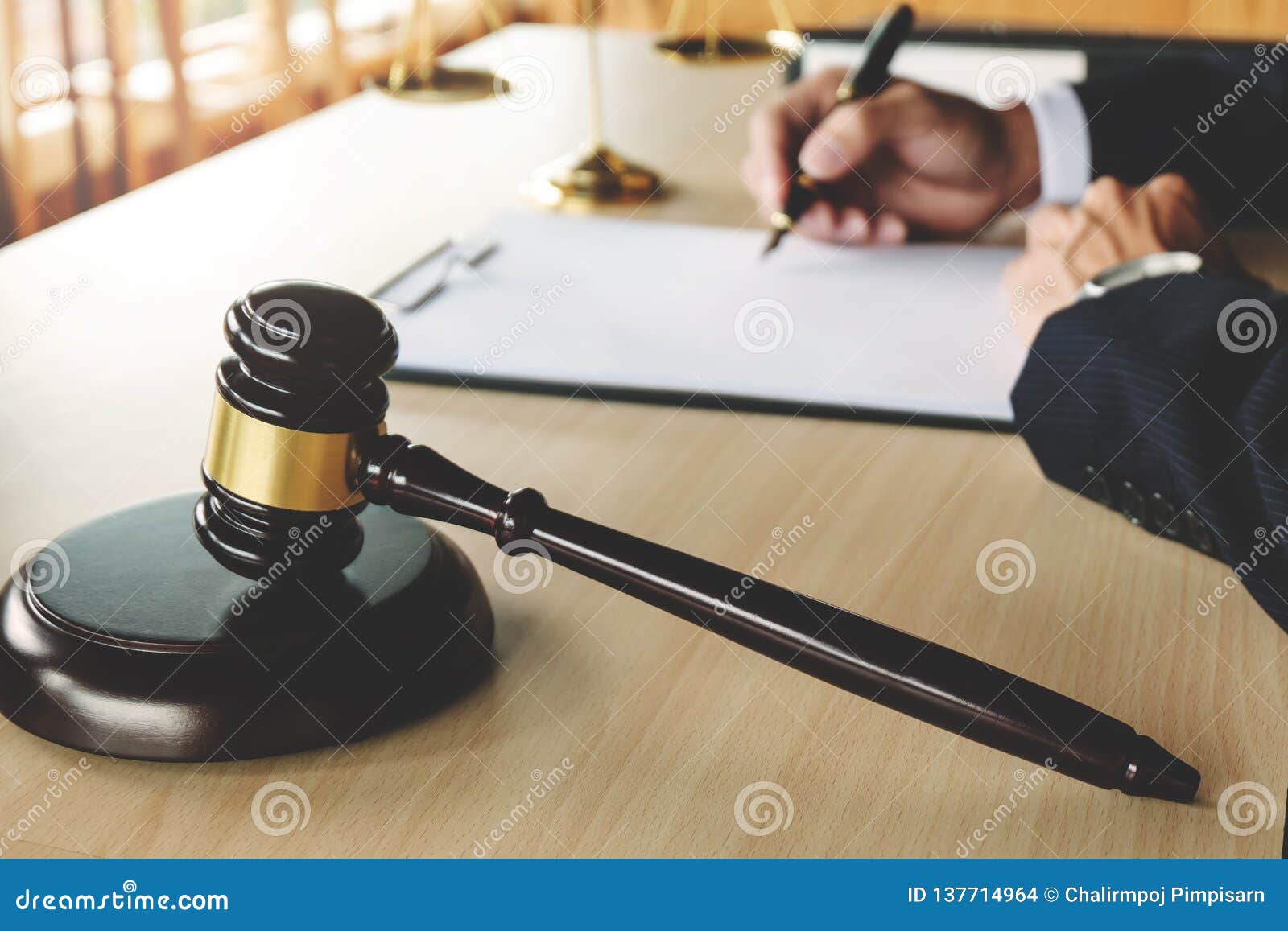 justice and law concept. lawyer working on paper documents at courtroom