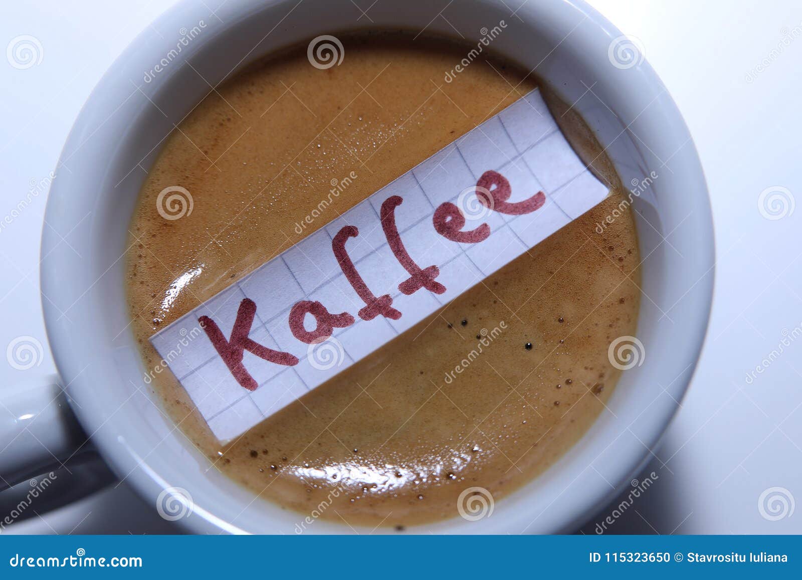 Kaffee word in German for Coffee in English. Learn new language, Kaffee word in German written on a mathematics paper note, for the English Coffee. White background, copy-space