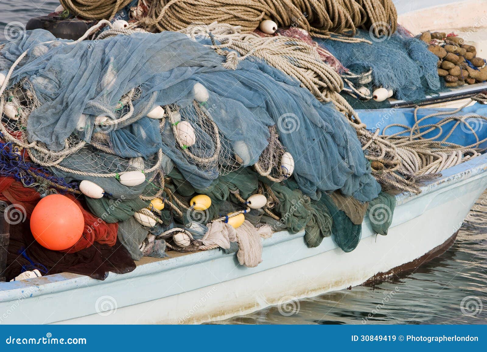 kalba uae fishing nets piled high on boat in kalbar fujairah