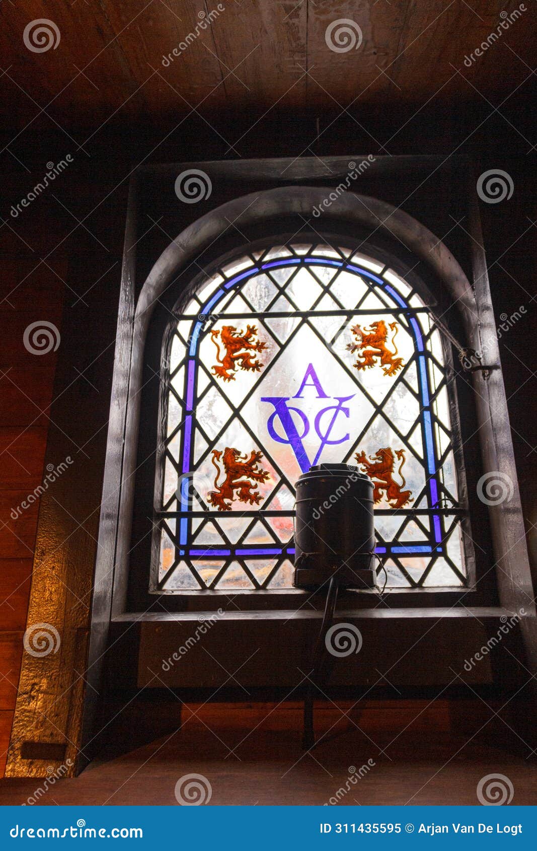kampen, the netherlands - march 30, 2018: kampen, the netherlands - march 30, 2018: window with logo of the dutch verenigde oost-