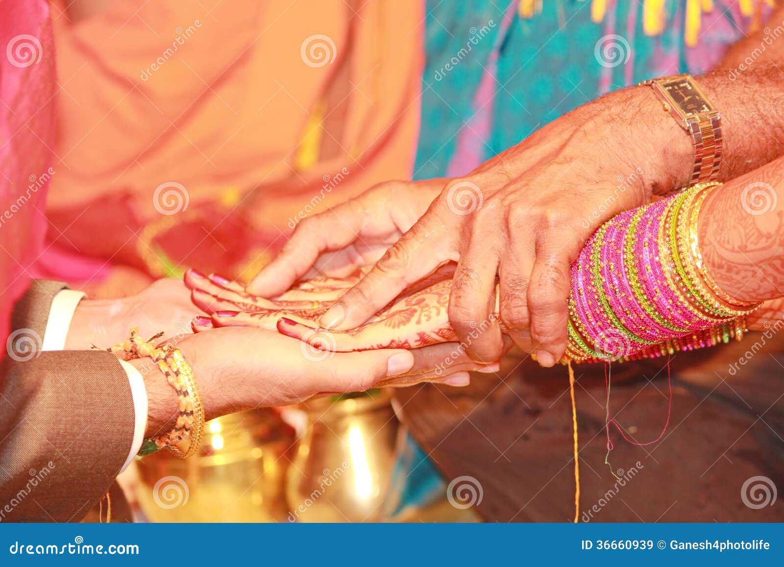 Bride putting wedding ring on groom's finger at traditional south Indian  wedding ceremony Stock Photo - Alamy