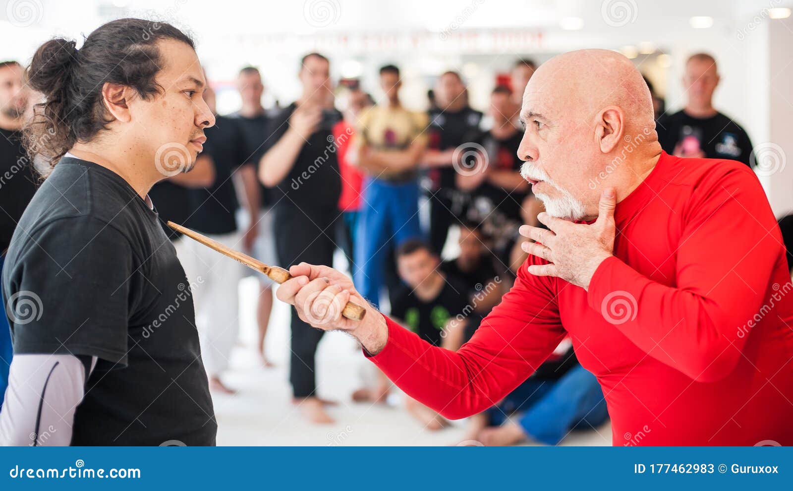 kapap instructor shows knife techniques to large group of students