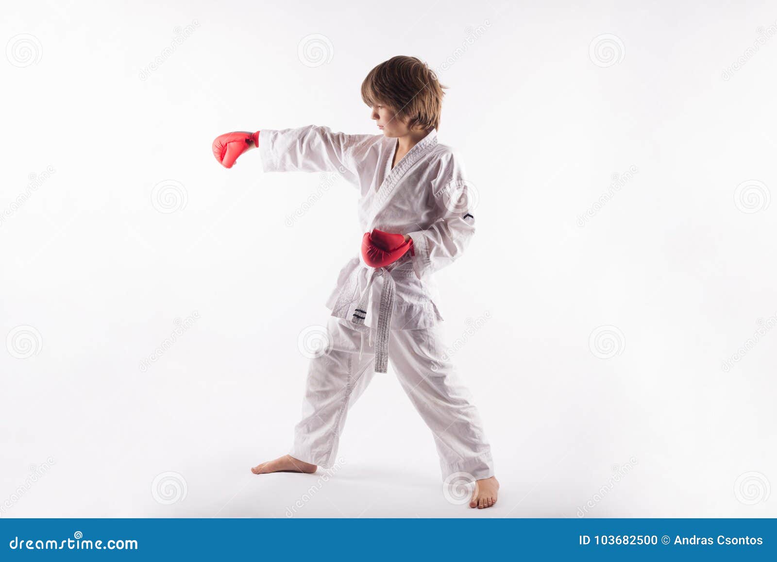 Karate Kid Wearing Kimono and Red Boxing Gloves Doing Exercises Stock Photo Image of position