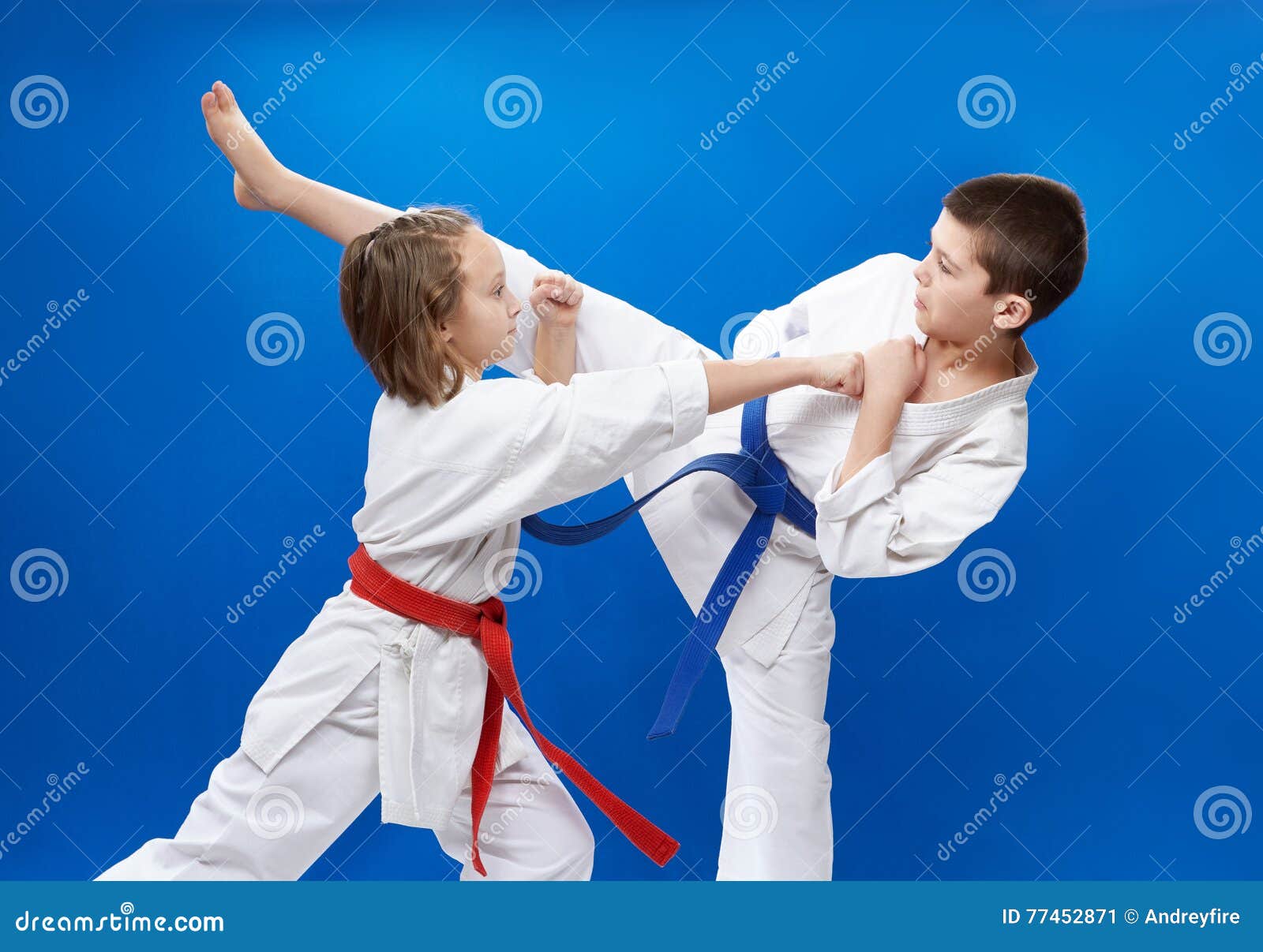 In Karategi Two Athletes are Doing Blocks and Kicks of Karate Stock