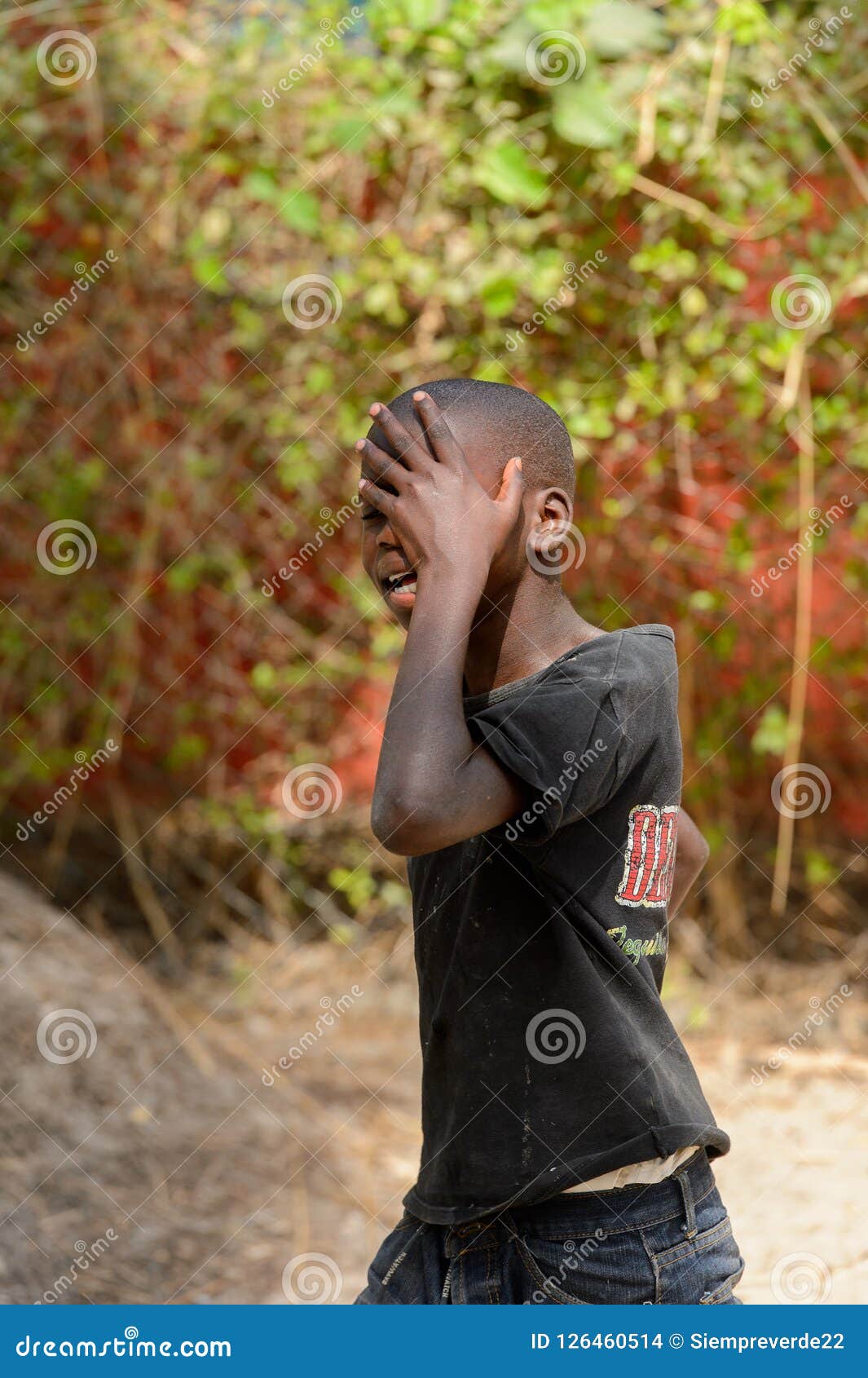 Unidentified Diola Boy Walks Along the Street in Kaschouane Vil ...